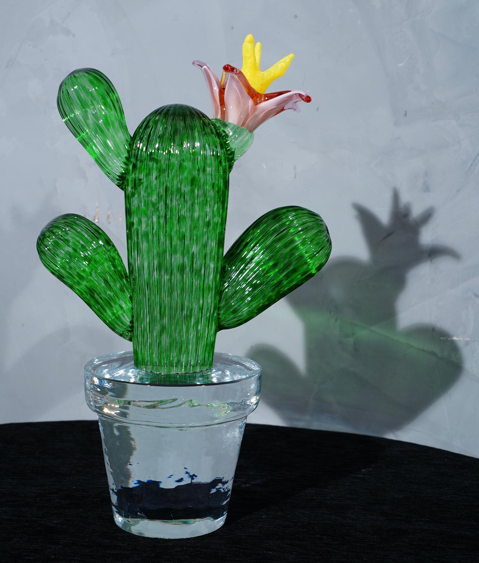 Italian design by Marta Marzotto creator of style, this cactus is a fashion icon of the Italian style, emerald green with a red and yellow colored spot, the flower.

In limited edition, as can be seen from the writing under the transparent vase (