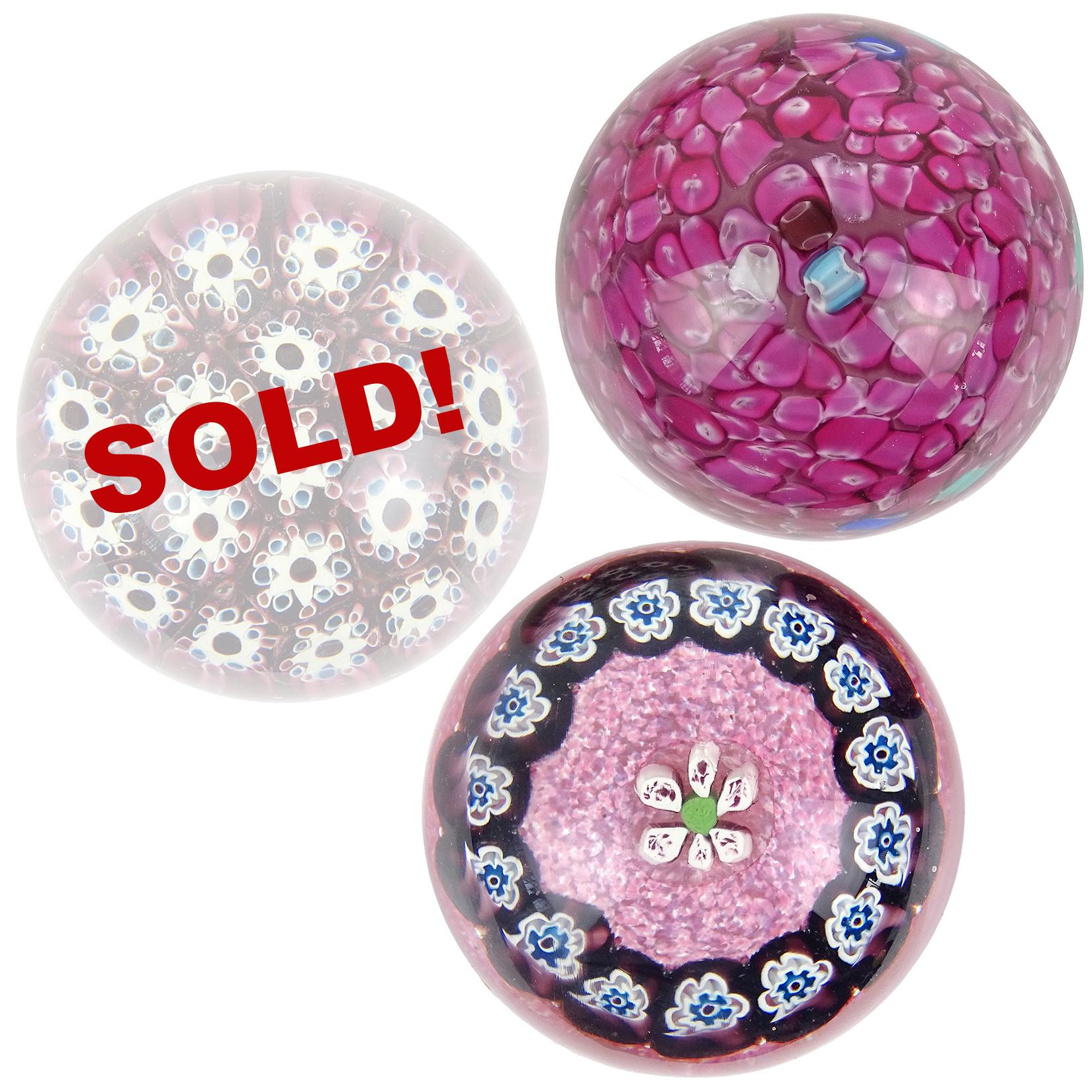 Priced per item (2 designs available, as shown). Beautiful vintage Murano hand blown Italian art glass paperweights. Documented to Fratelli Toso and Alfredo Barbini. The first paperweight has magenta pink cut canes scramble paperweight with