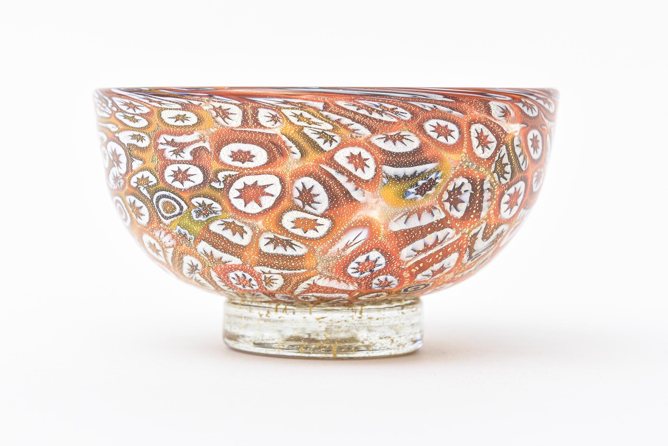 This Italian murano glass bowl by Fratelli Toso has the most incredible colors of the Murrine technique. Murrine are colored patterns made in a glass cane that are revealed when the cane is cut into cross sections. One style is the millefiori which