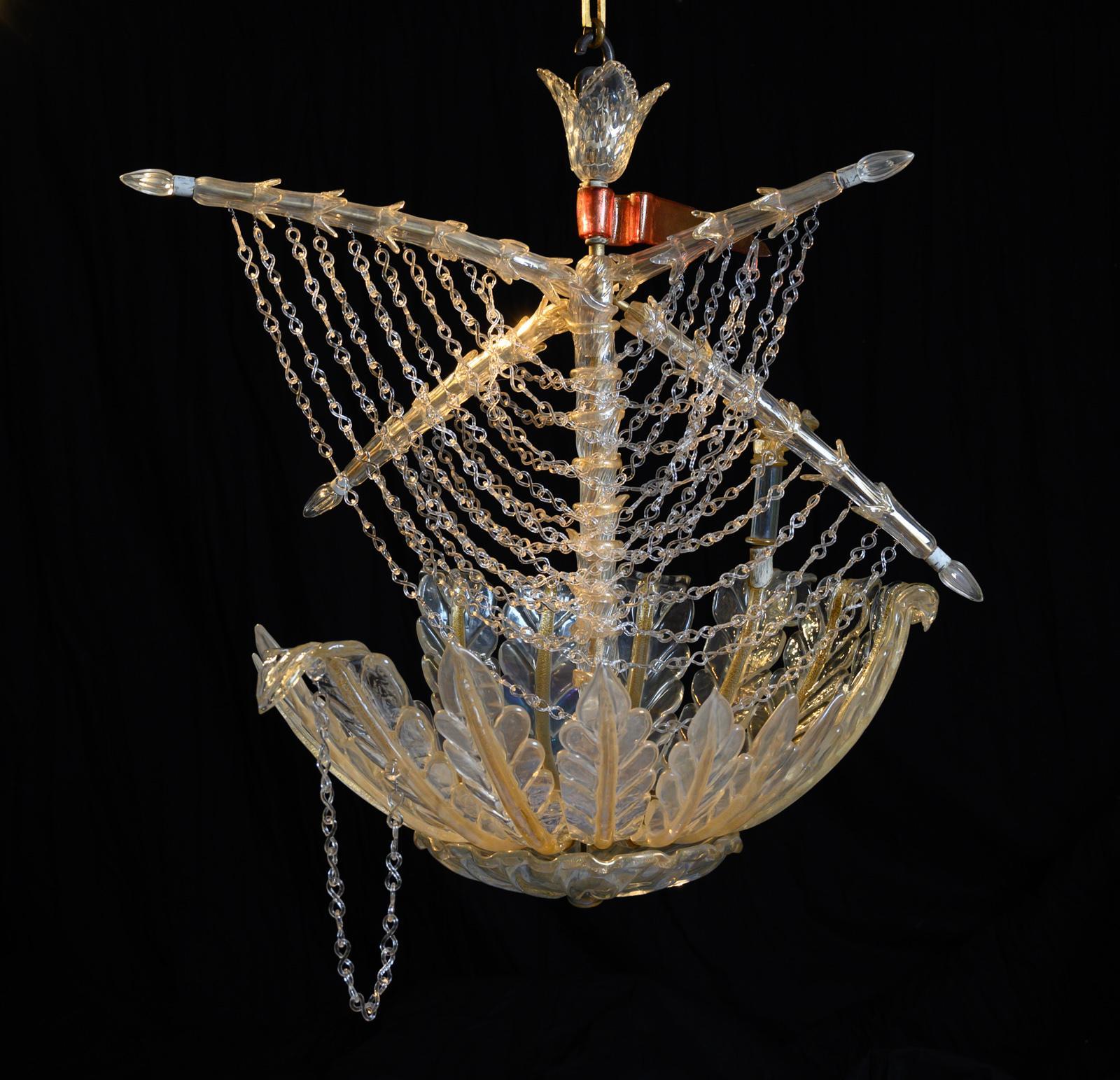Extremely rare, signed and documented Murano galleon chandelier by Seguso, Vetri d’Arte, Venice.
This unique fantasy hanging light, supplied by Veronese Paris in the 1950s was designed and hand crafted by Angello Seguso, expertly made in iridescent