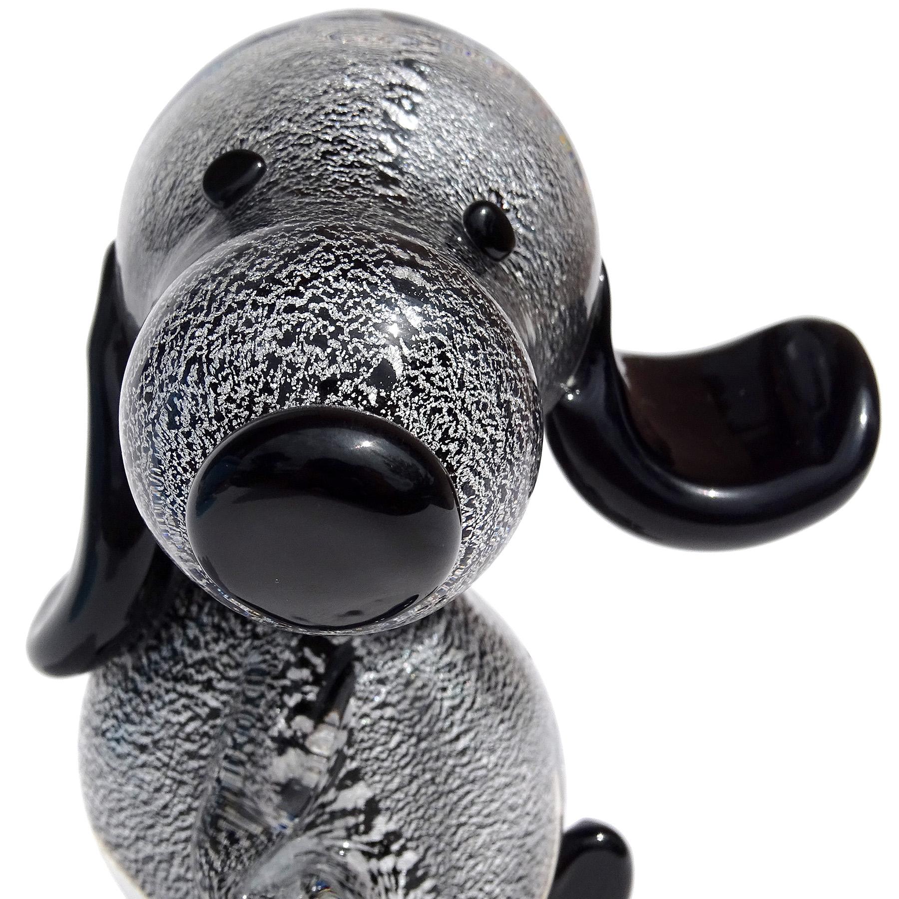 Beautiful vintage Murano hand blown black and silver flecks Italian art glass Snoopy puppy dog sculpture / figure. Attributed to the Gambaro & Poggi workshops. The piece is super cute, with tilted head and long floppy ears, one of which is flopping