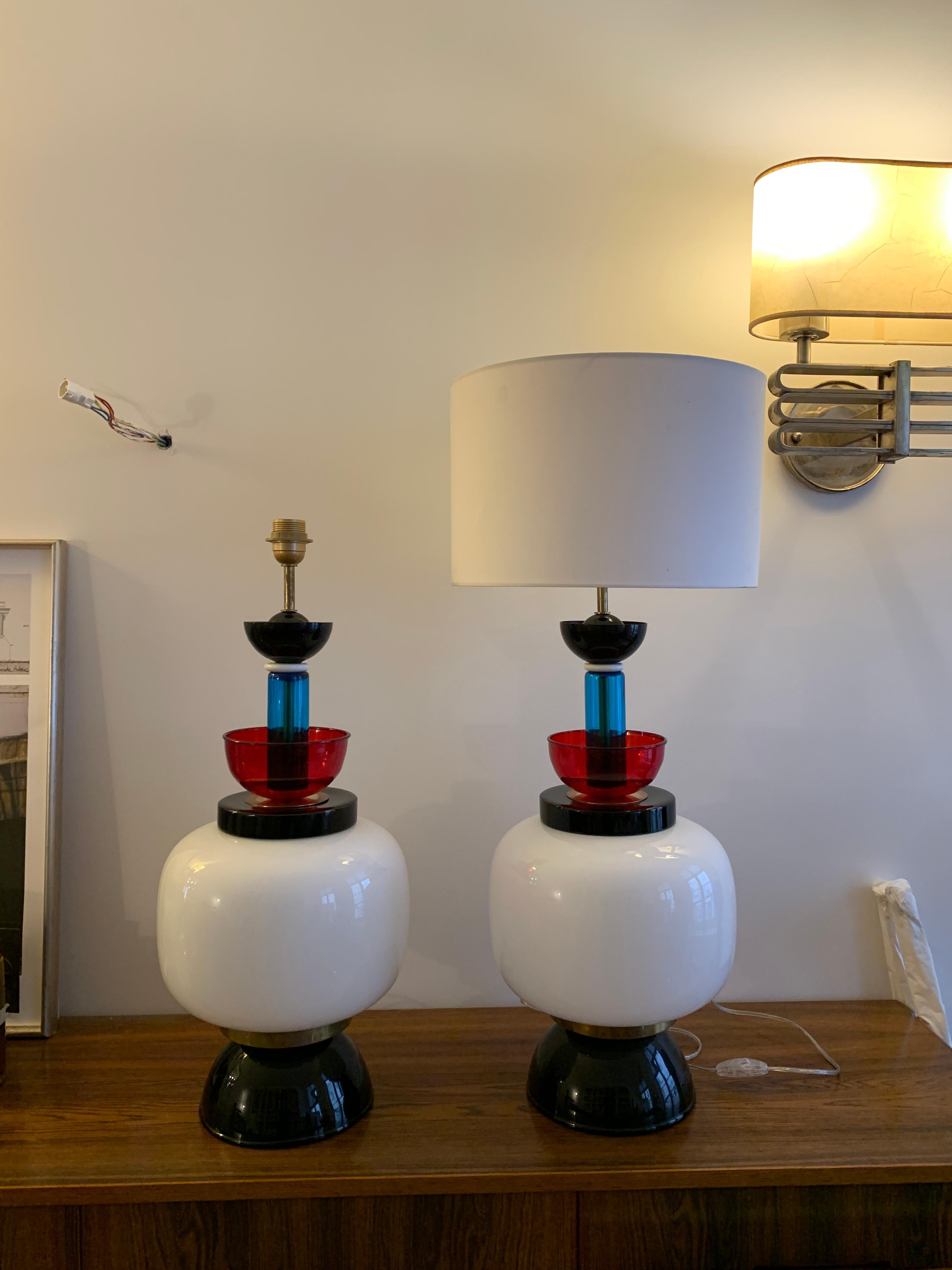 One of a kind oversized table lamps in style of Ettore Sottsass made in Italy Murano 1970.
Probably made by Venini 
Theses impressive table lamps made of several blown glass parts with bright colors and brass disks , Good condition. 
The lamps