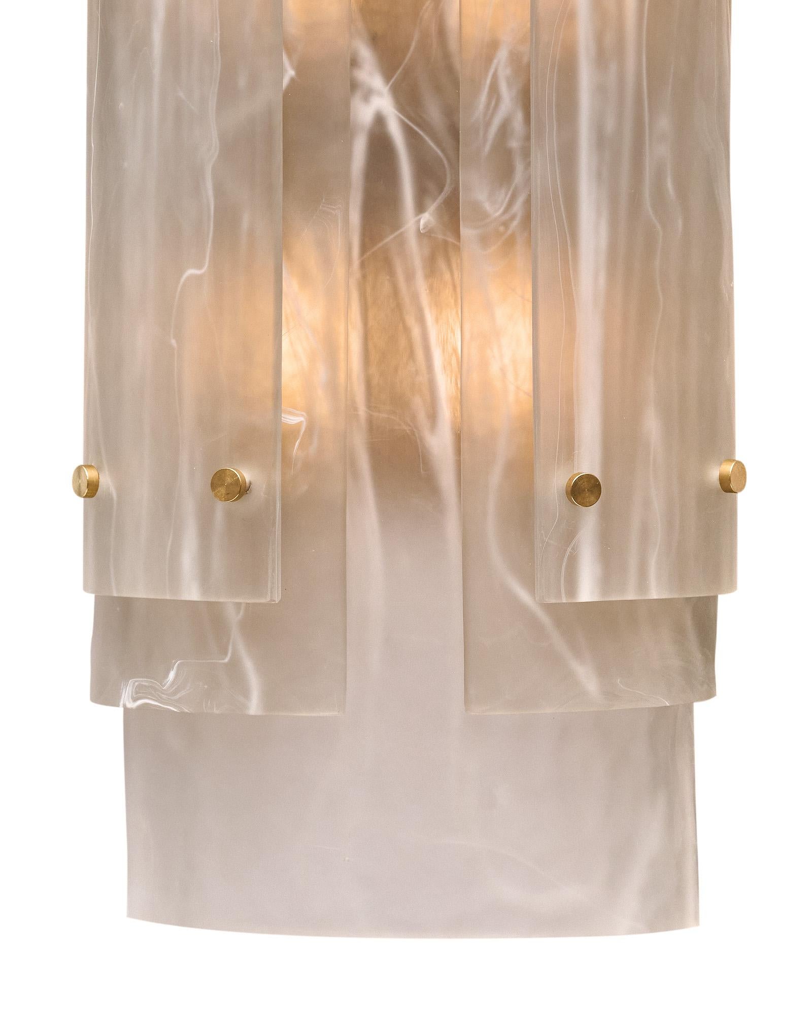 Pair of sconces hand-crafted by artisan glass blowers in Murano, Italy. This sconce is made with layers of hand-blown glass made using a technique to give them an alabaster pattern. The layers of glass are held in place on a brass structure. They