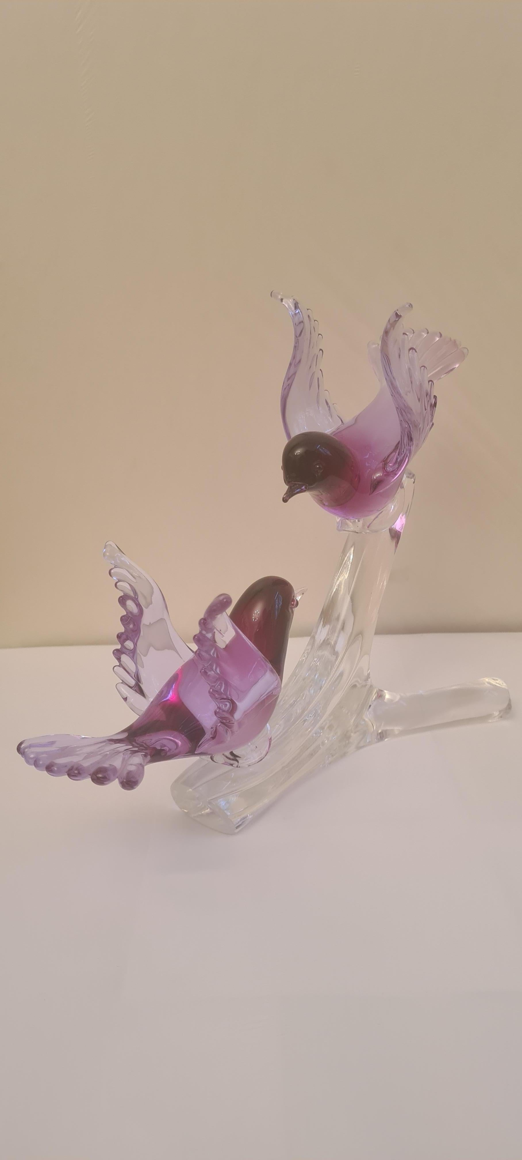 Beautiful Murano glass alexandrite neodymium birds on the branch in purple and clear, signed by the artist Renato Anatra; years 1960-1970. The colour of the birds changes to fluorescent and to black light. In excellent conditon.