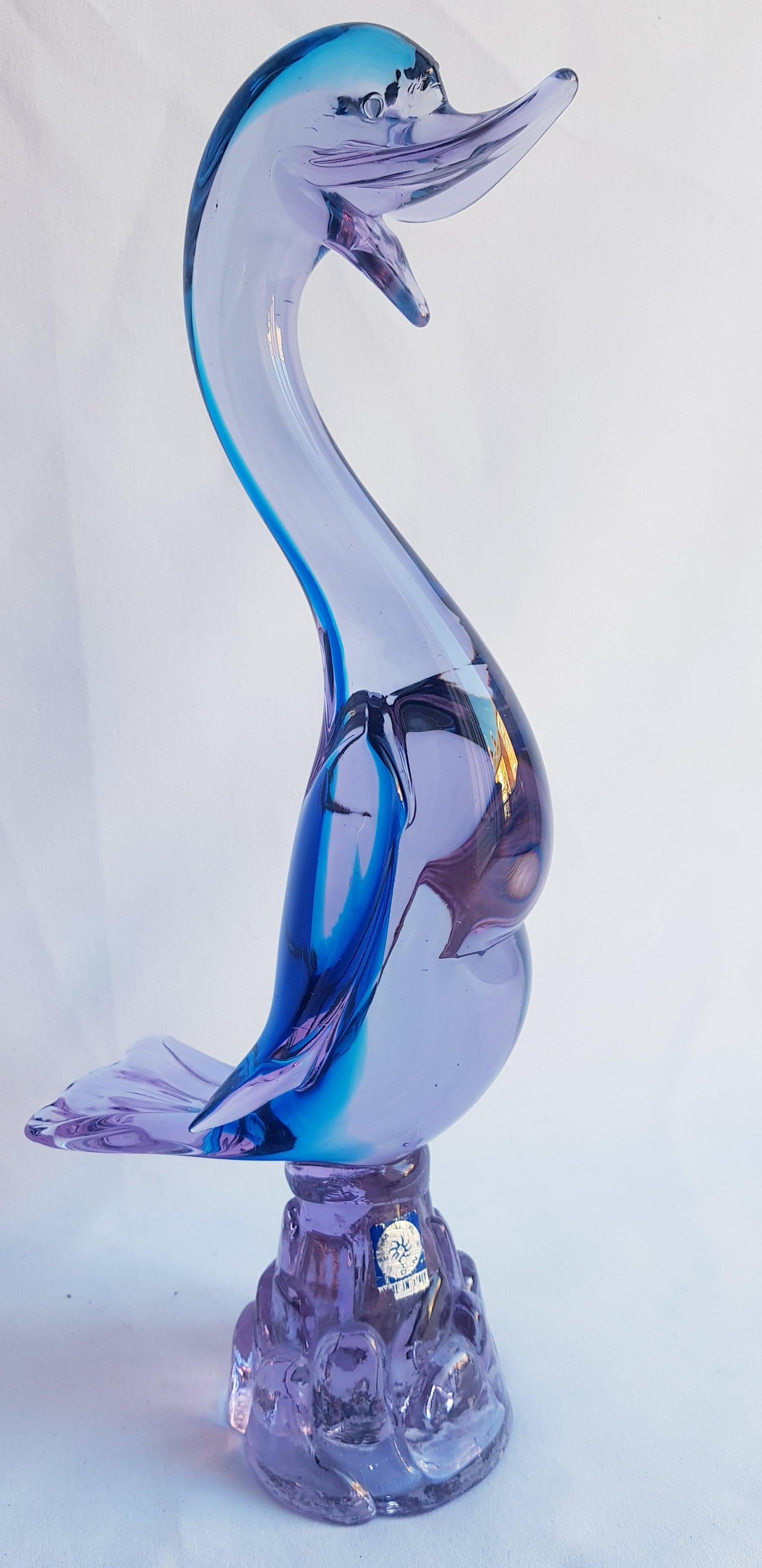 Beautiful Murano glass alexandrite neodymium colour-changing sommerso duck in blue and purple, attributed to Livio Seguso; years 1960-1970. In excellent condition. This tip of Neodymium glass is reactive to black light have very beautiful pink