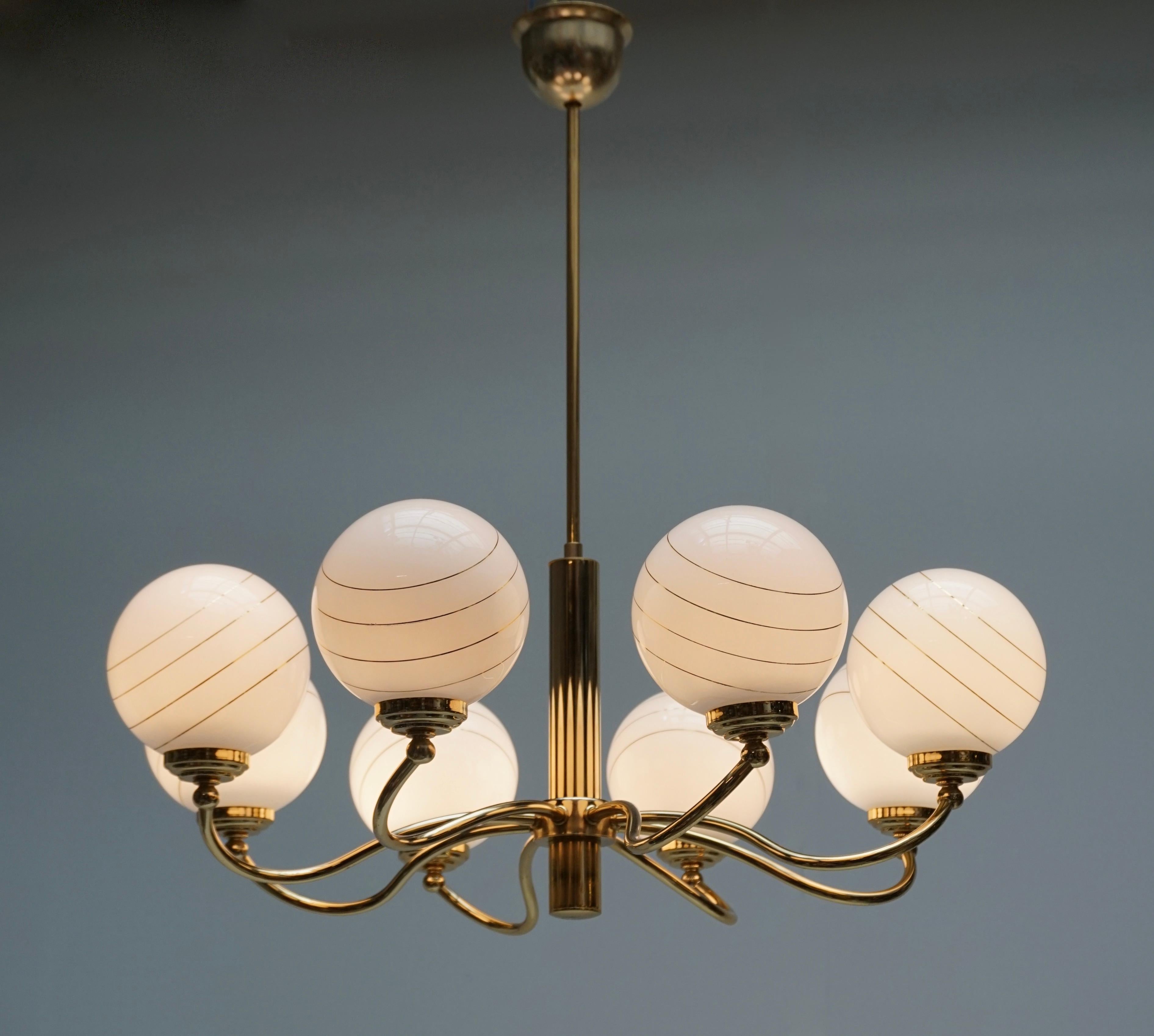 Italian Murano glass and brass eight-arms chandelier.
Measures: Diameter 70 cm.
Height 70 cm.
Eight E14 bulbs.

 