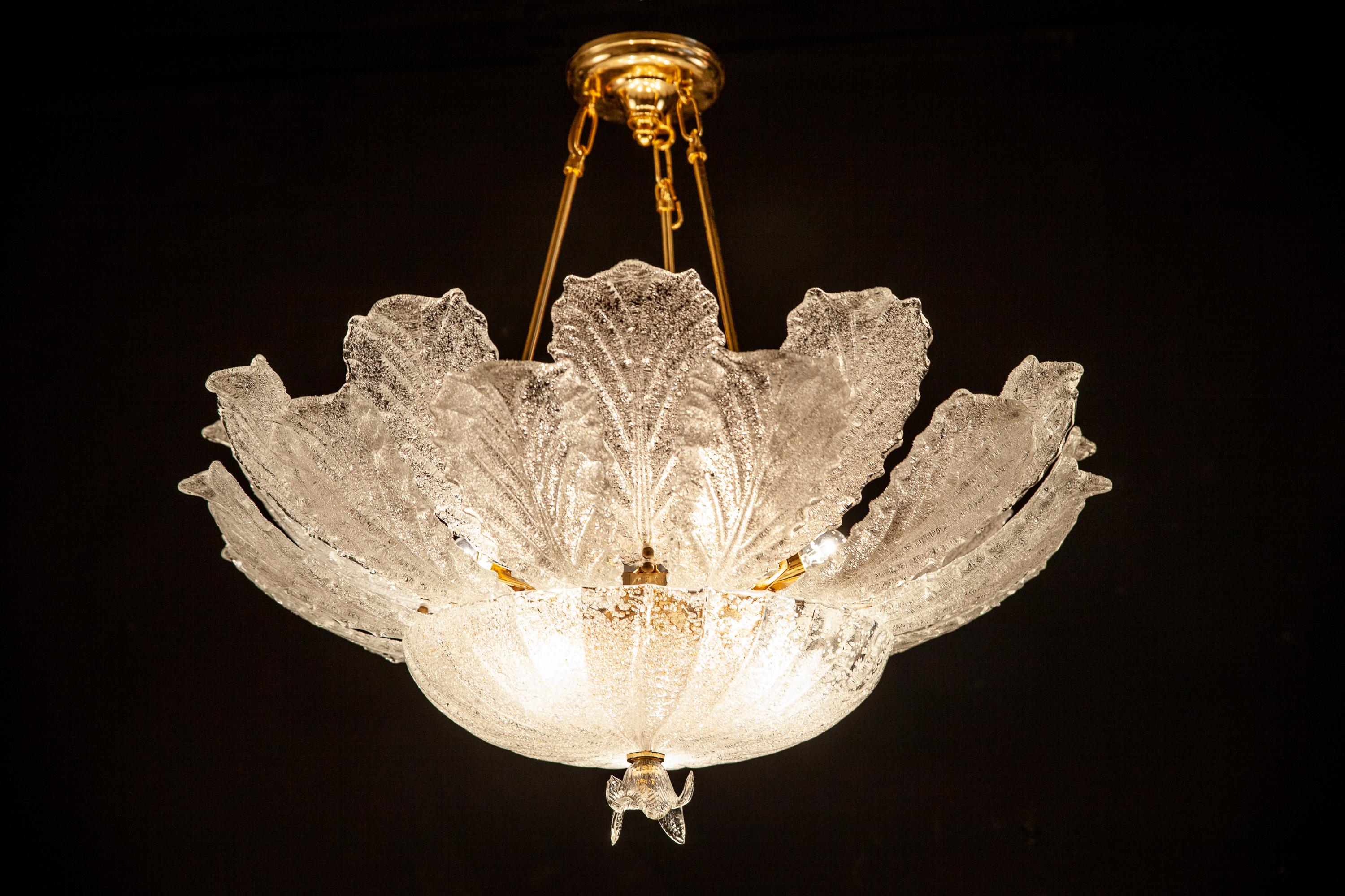 Lovely Italian Brass mounted Murano glass Ice color Chandelier .
Perfect condition.
Six E 14 Light bulbs .