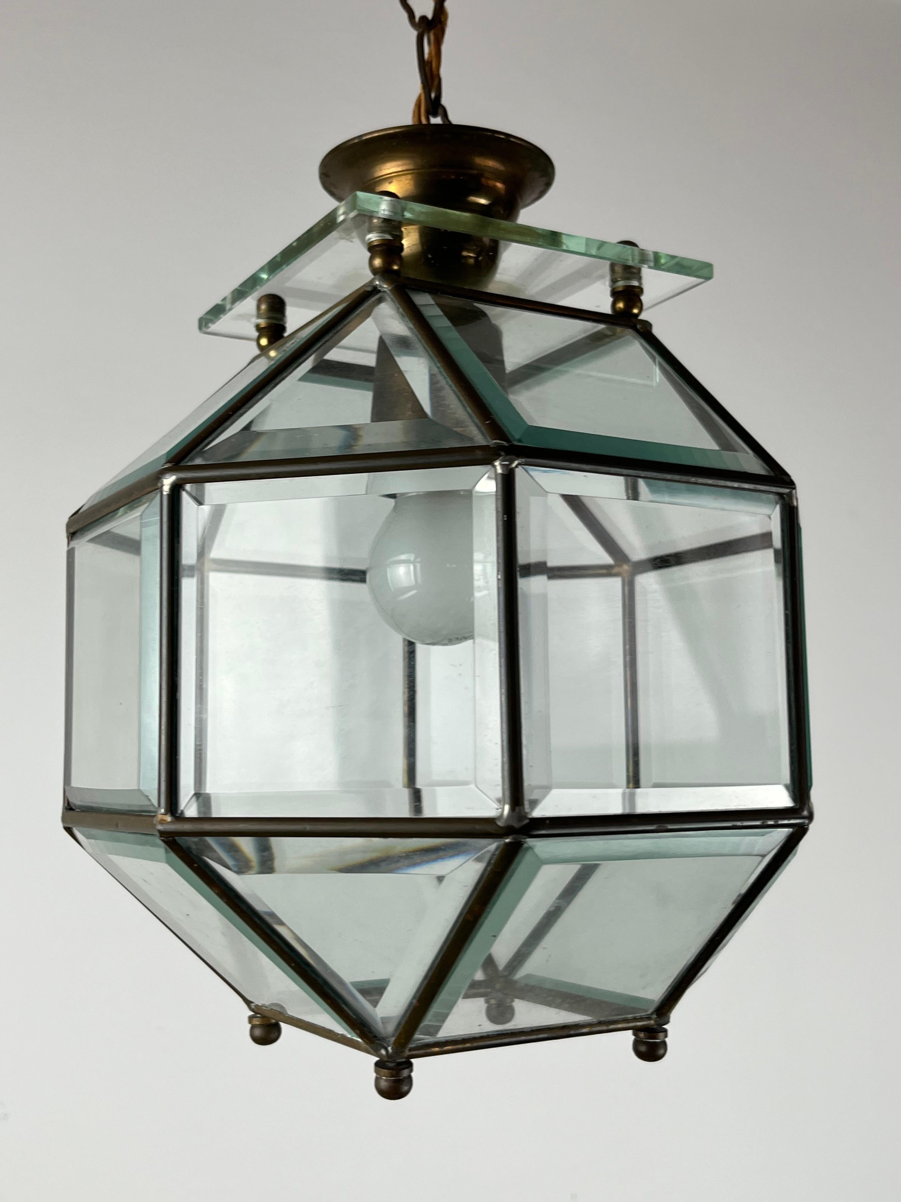 Murano Glass and Brass Lantern Chandelier Attributed to Fontana Arte, Italy. It dates back to the 1950s. Good condition, small signs of aging. Glasses intact and working. Length with chain 115 cm.