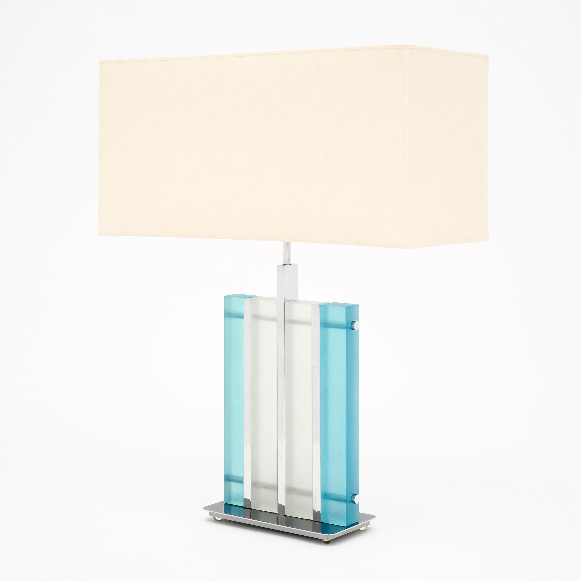 Murano glass aqua “tormalina” slab lamps with beautiful polished chrome structures. We love the hand-blown slab glass elements in both a frosted clear and a frosted aqua hue. These striking, modern fixtures have a great impact on a space. They have