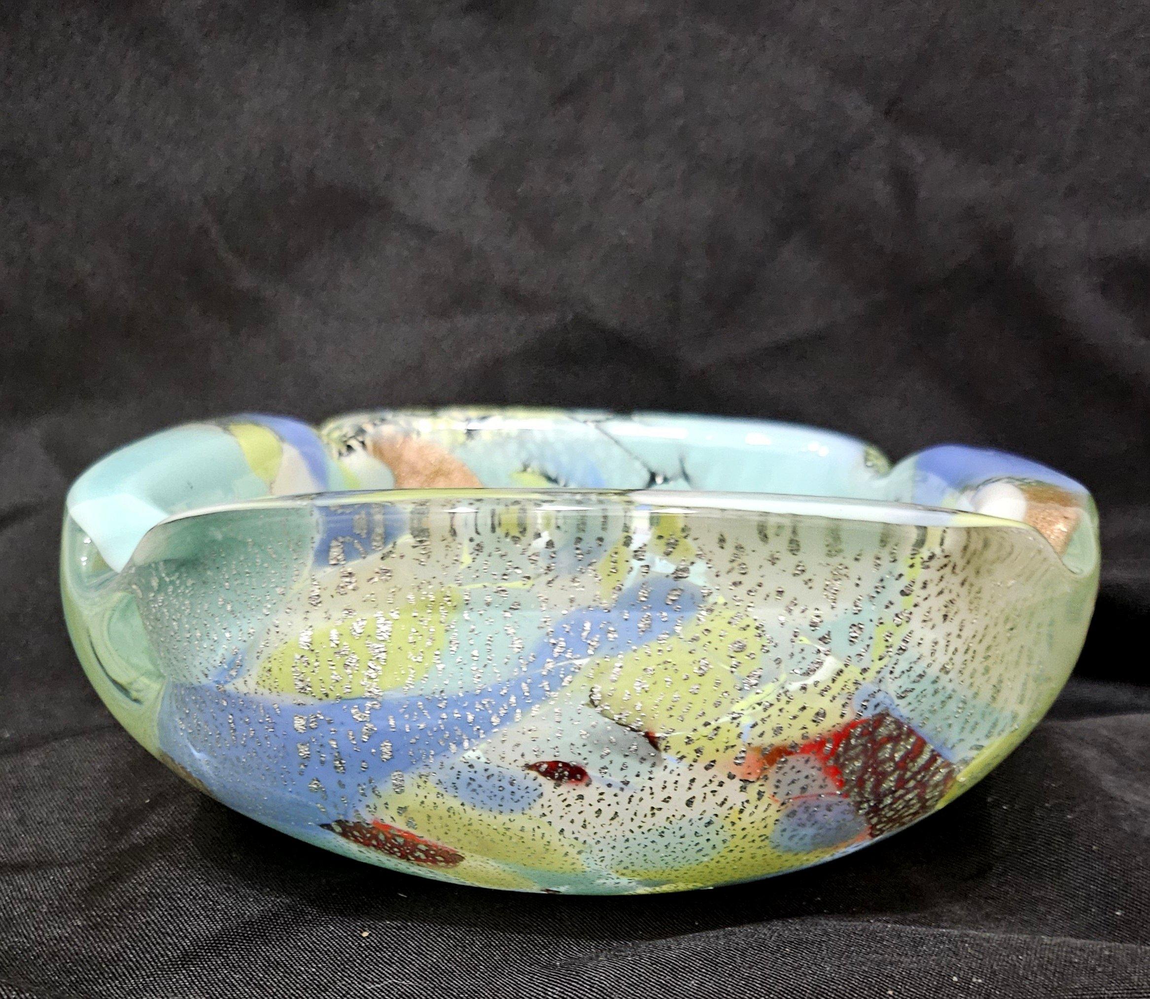 Murano Glass Ashtray / Bowl with Silver Fleck, A Macchie
Beautiful colors and patterns, a very special piece.  
Reminds us of Dino Martens but more likely could be AVeM.
Approximately 5.75 (across)  x 7 (point to point) x 2.5 (high) inches
Note: