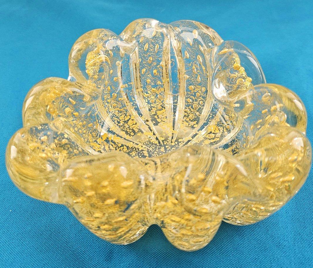 Murano Glass Rigaree Bullicante Bowl with Gold Polveri - Barovier & Toso likely
There are a few dark specks in the glass, likely ash from the blowing process.
There is also a rough area on the underside of the tip.
IMPORTANT INFORMATION FOLLOWS;