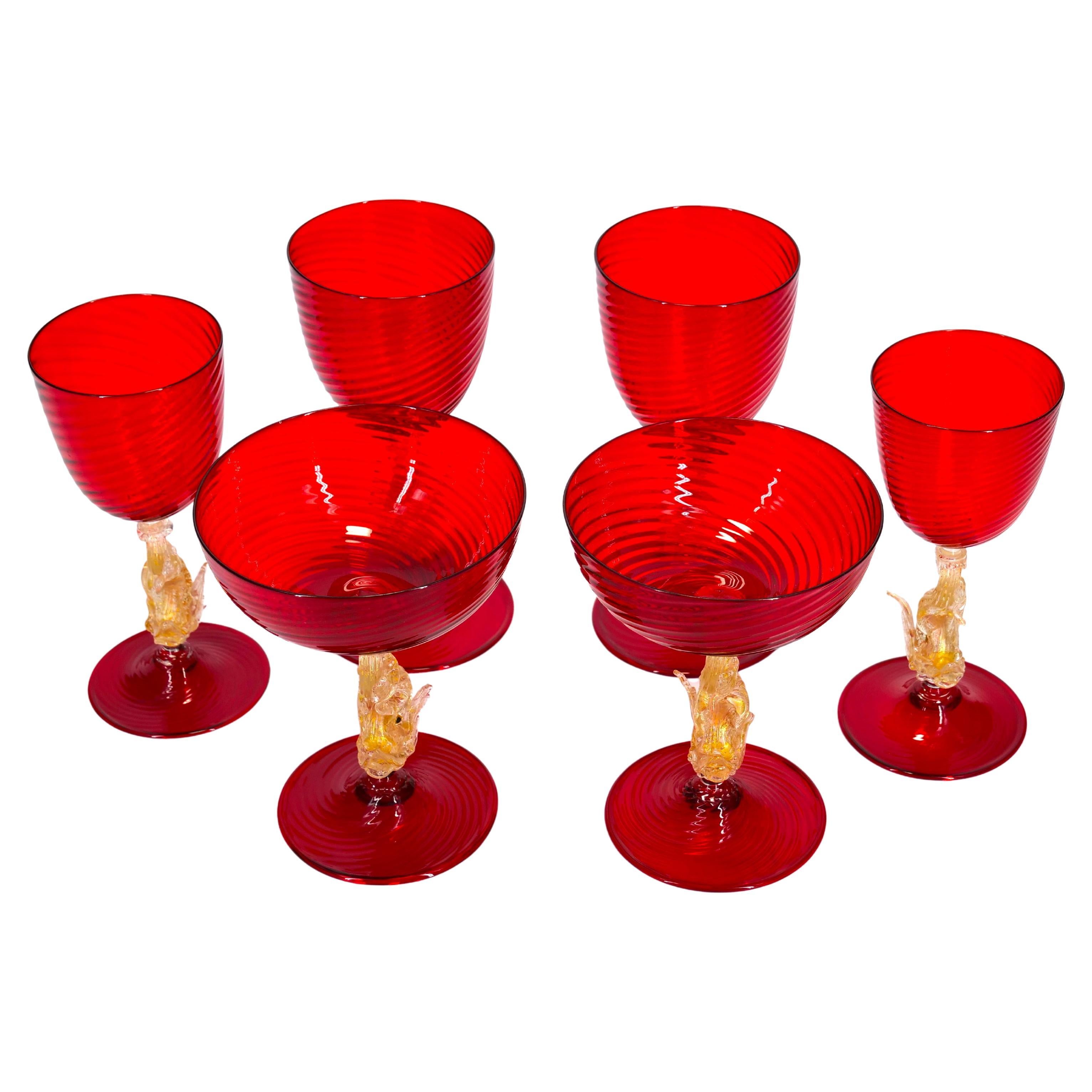 Early 20th century Murano glass with gold flecks barware / tableware glassware set of six pieces. Each one features an exterior swirl design details with a dolphin stem resting on a round base. Set consist of two champagne coupe 6