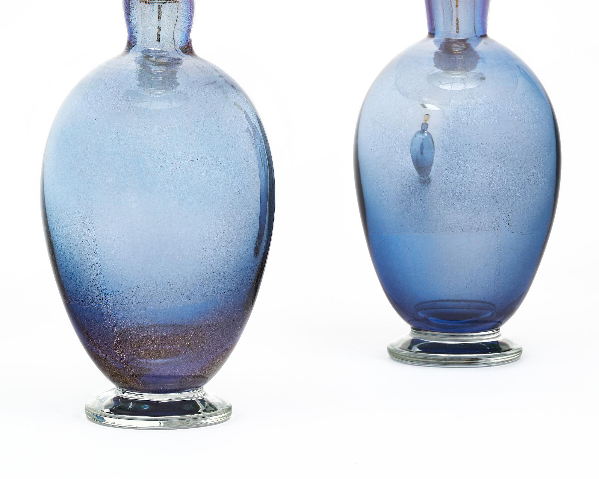 A pair of Italian hand-blown Murano glass mirrored avventurina lamps that contain 23 carat gold flecks and beautiful blue glass. The process of fusing the gold flecks within the glass was aptly named as it means “adventure”, a charming way of