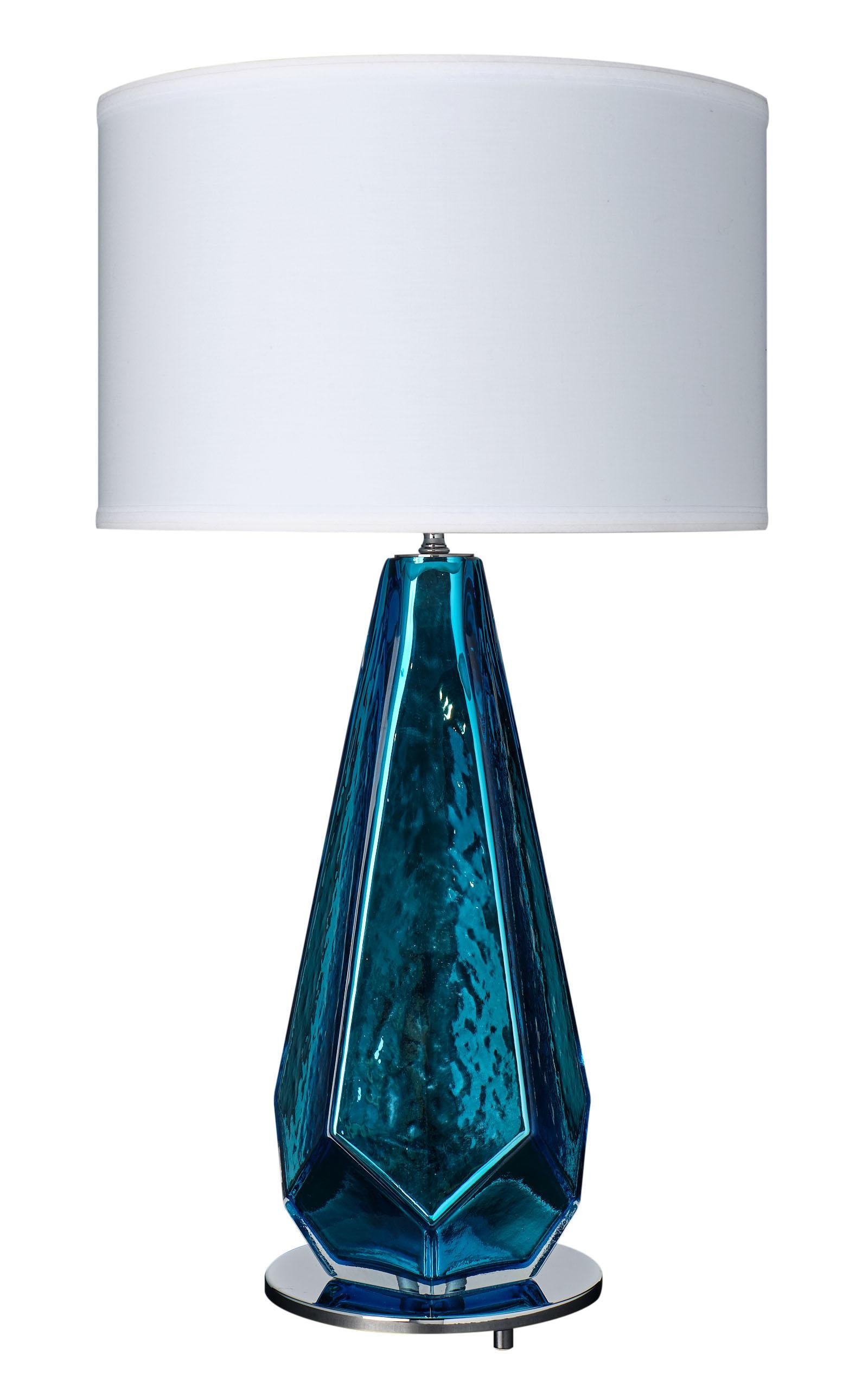 An important pair of blue “specchiate” Murano glass lamps. This mirrored pair has a striking metallic color and impressive shape. They have been newly wired to fit US standards and sit on a chrome finished base.