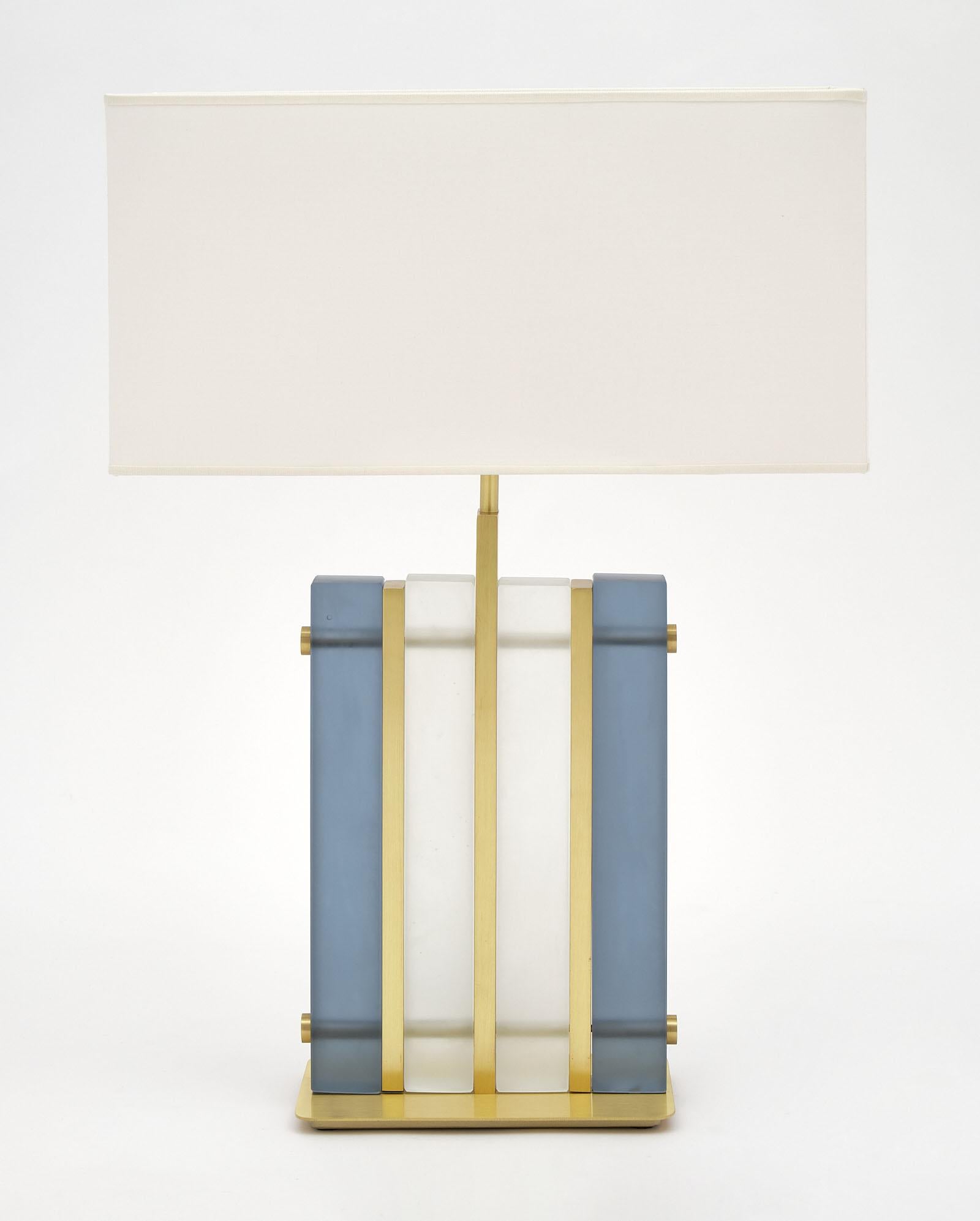 Murano glass blue “tormalina” slab lamps with beautiful brushed brass structure. We love the hand blown slab glass elements in both a frosted clear and frosted blue hue. These striking; modern fixtures have great impact on a space. They have been