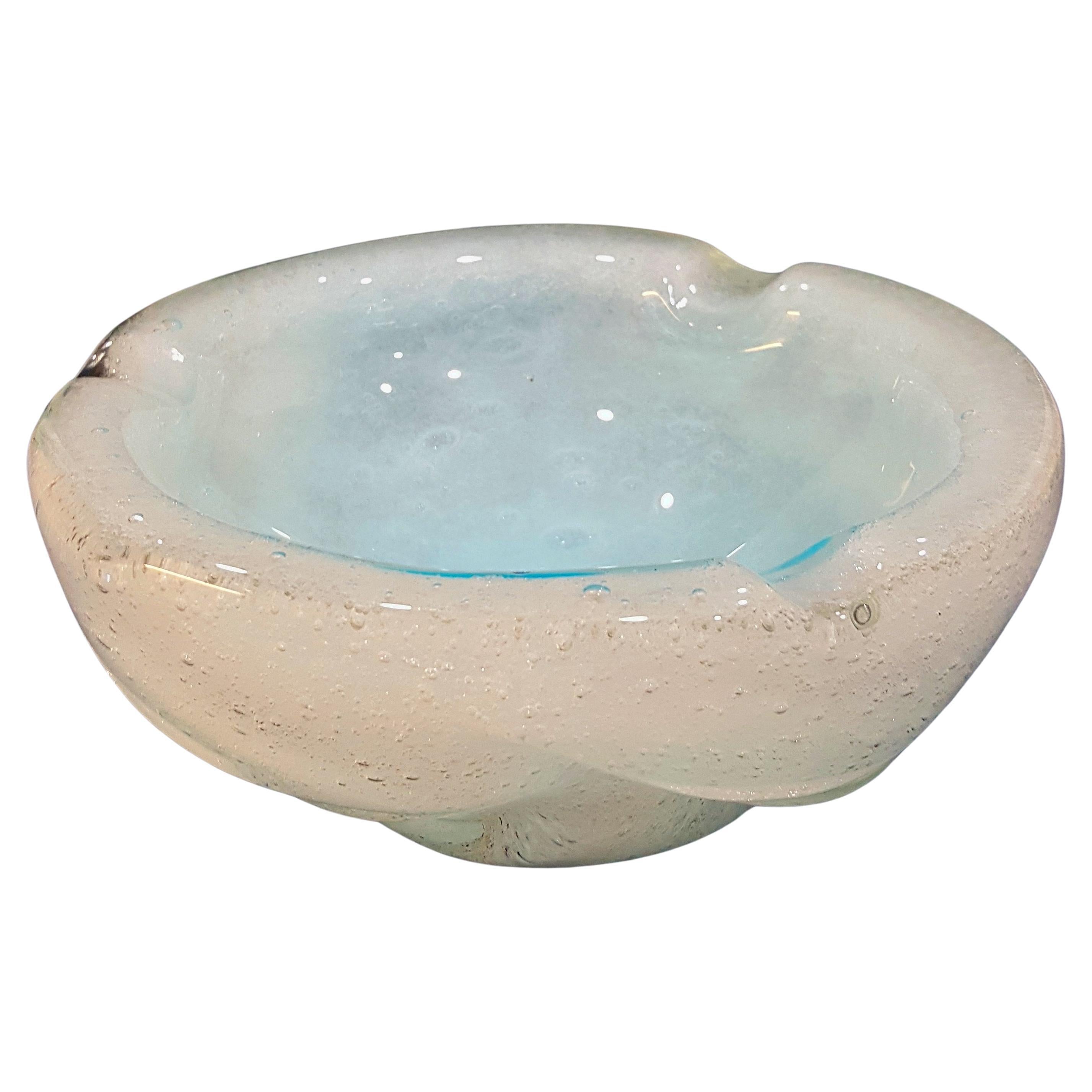 Murano Glass Bollicine Ashtray, Sky Blue in White, by Seguso
Sky blue encased in white, hand blown with generous bollicine (often confused for pulegoso) bubbles. 
The base is polished smooth and shows the indention where the pontil was removed.
