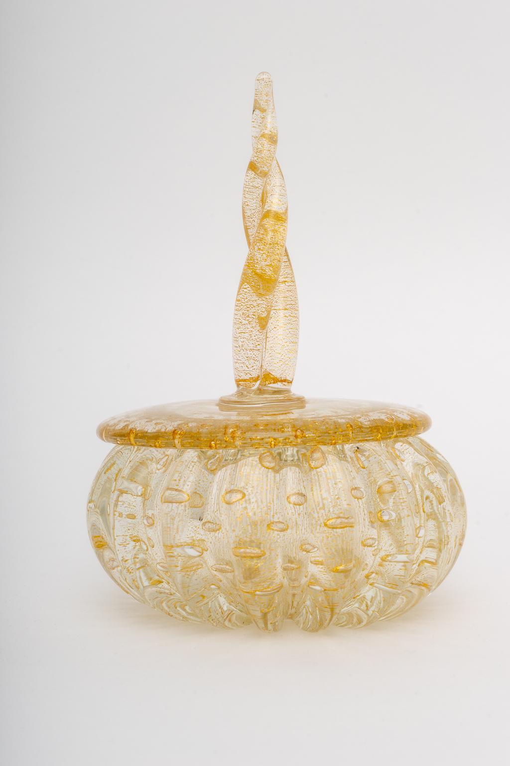 This stylish and chic Murano glass bonbonniere dates to the 1950s-1960s and was created by Barovier et Toso and sold by Camer Glass. The piece could be used to hold your candies, desk accessories or perhaps on your dressing table.

Note: Retains