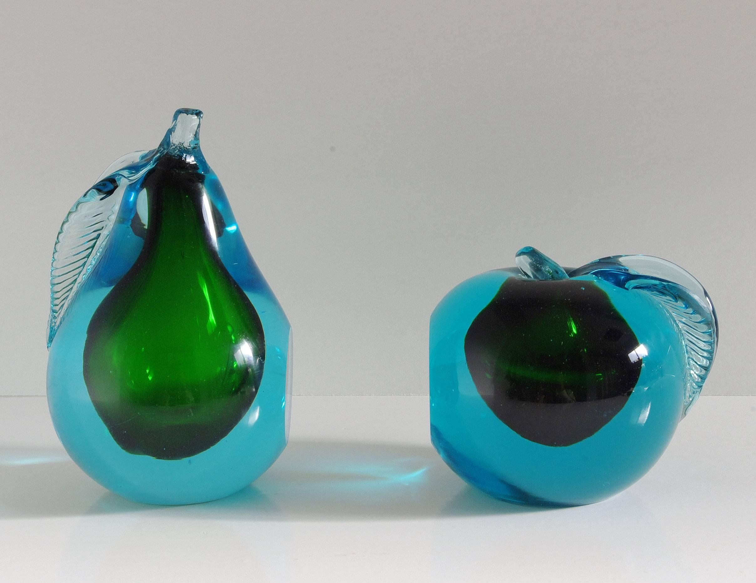 Vintage Italian set of blue and green Murano glass book ends carefully hand blown in Sommerso technique to the shape of an apple and pear / Made in Italy in the 1960's.
Pear Diameter: 3.5 inches / Pear Height: 6 inches
Apple Diameter: 4 inches /