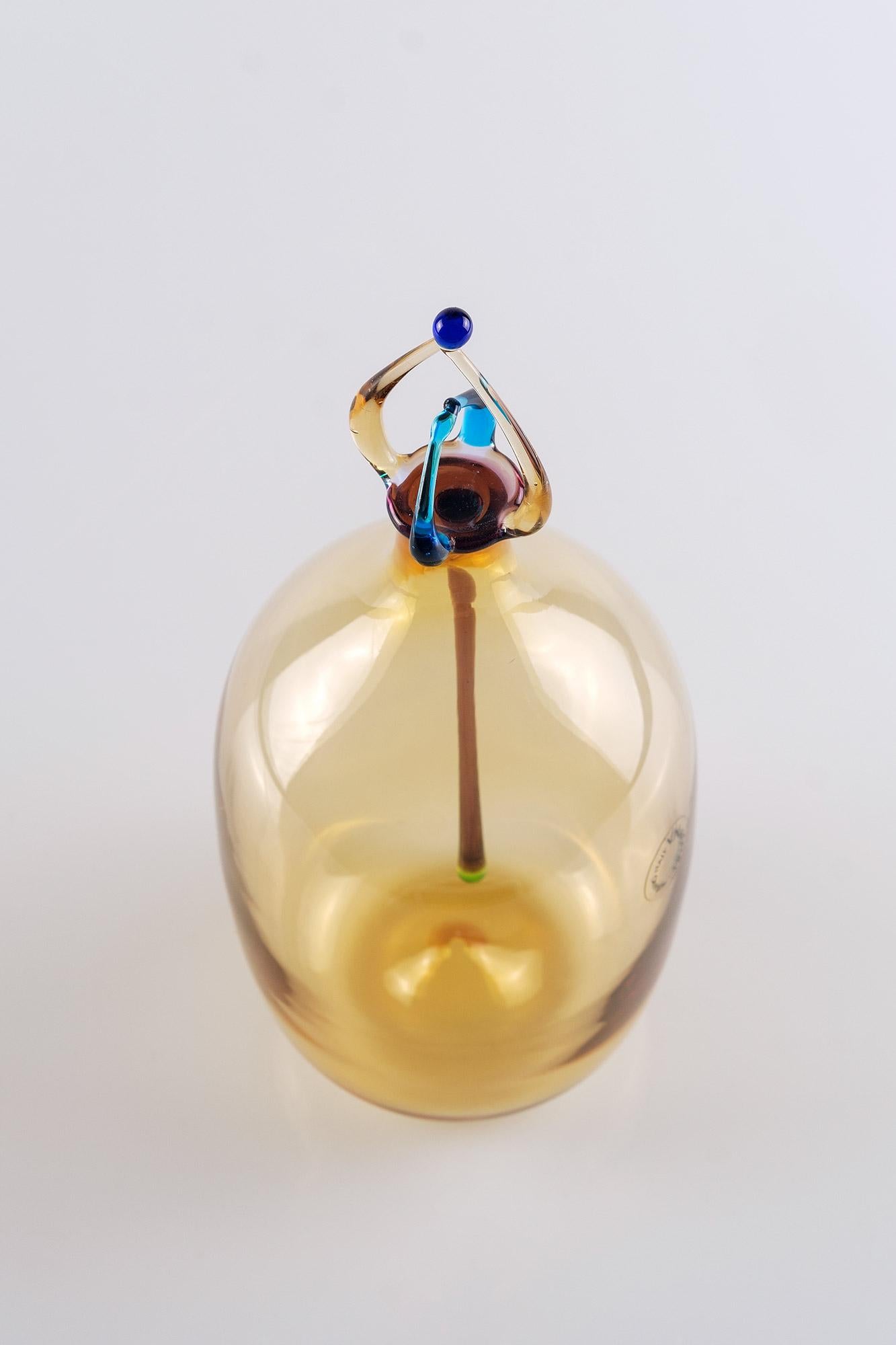 Beautiful colourful perfume bottle made of mouth blown yellow Murano glassy Vincenzo Nason.
The design is inspired by the Memphis Group of the 1980's early 1990's.
Signed V. Nason near the base of the bottle.