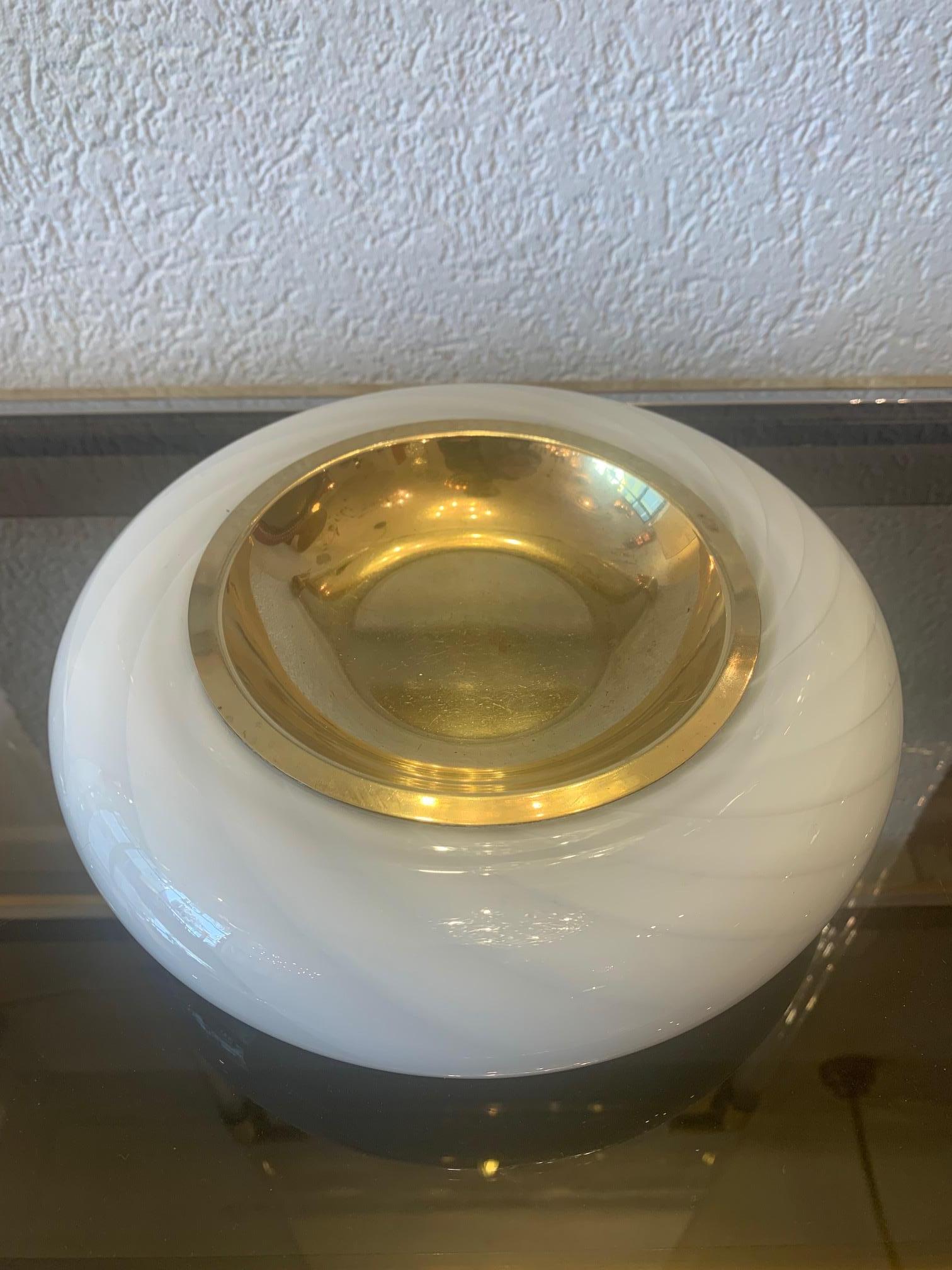 Murano glass and brass ashtray or pocket emptier by Tommaso Barbi, Italy ca. 1970s
Measures: 24 cm diameter, 7 cm high
Very good condition.
