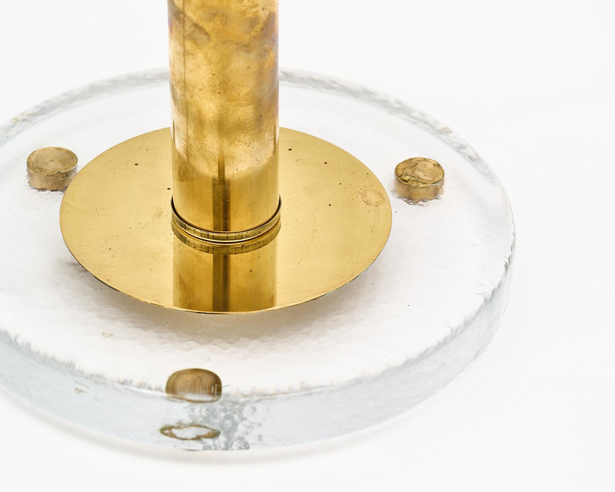Murano Glass lamp, Italian, from the island of Murano. This hand-blown modernist lamp feature a cluster of clear glass spheres around a cylindrical brass stem. The base is a hand-blown glass base as well. It has been newly wired to fit US standards.