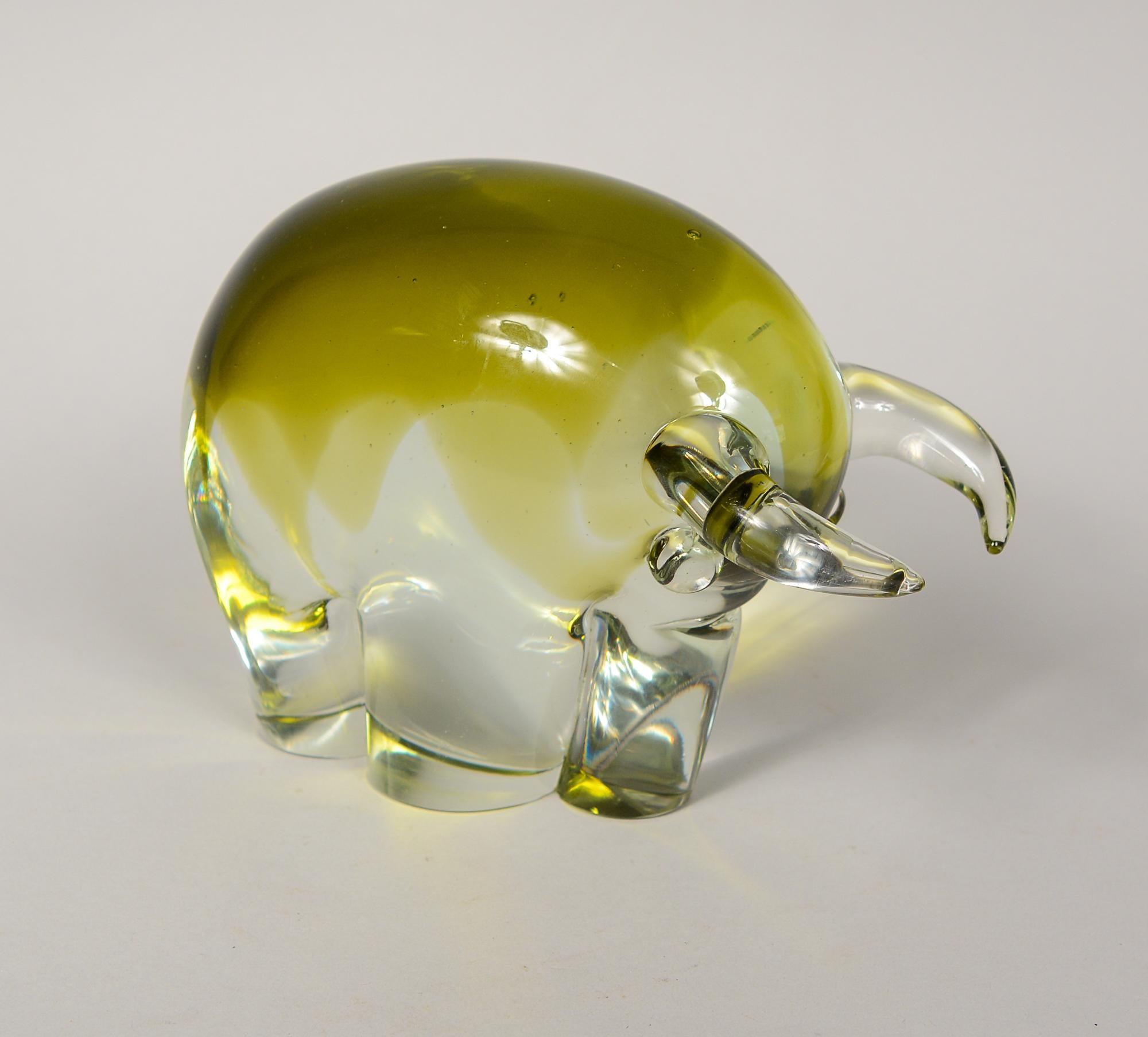 Heavy modernist glass bull by Luciano Gaspari for Salviati. The bull is clear glass with a sommerso layer of yellow in the top portion. There are couple tiny chips on the bottom edge of the base. One horn has a few light scratches.