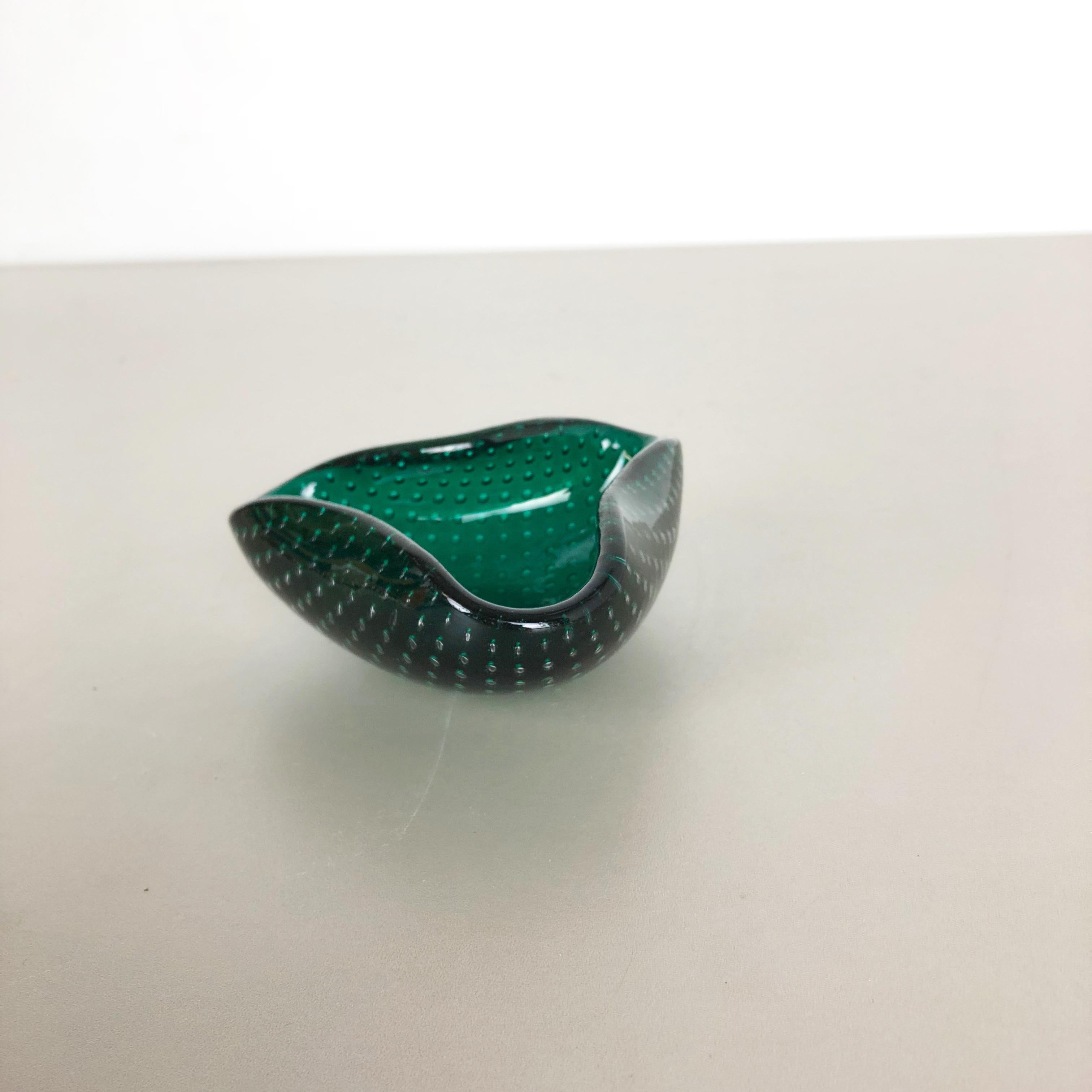 Article:

Murano glass bowl, ashtray element


Origin:

Murano, Italy


Decade:

1970s


This original glass shell bowl was produced in the 1970s in Murano, Italy. An elegant green Murano glass element utilizing the bullicante