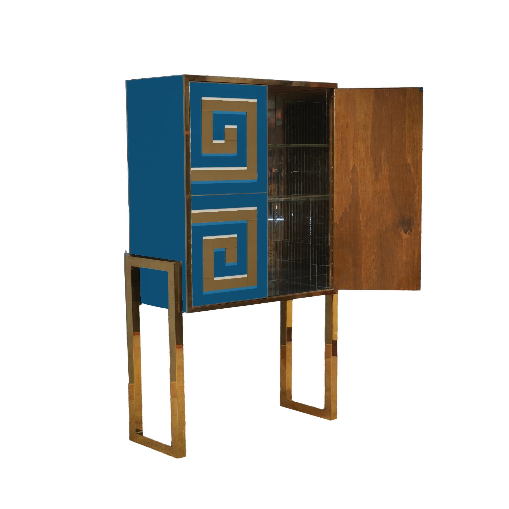 Murano Glass Cabinet with a 3D Optical Effect in blue and gold, a masterpiece of modern craftsmanship that combines the timeless elegance of Mid-Century design with the unique artistry of Italian artisans. 

Murano glass carvings that create a