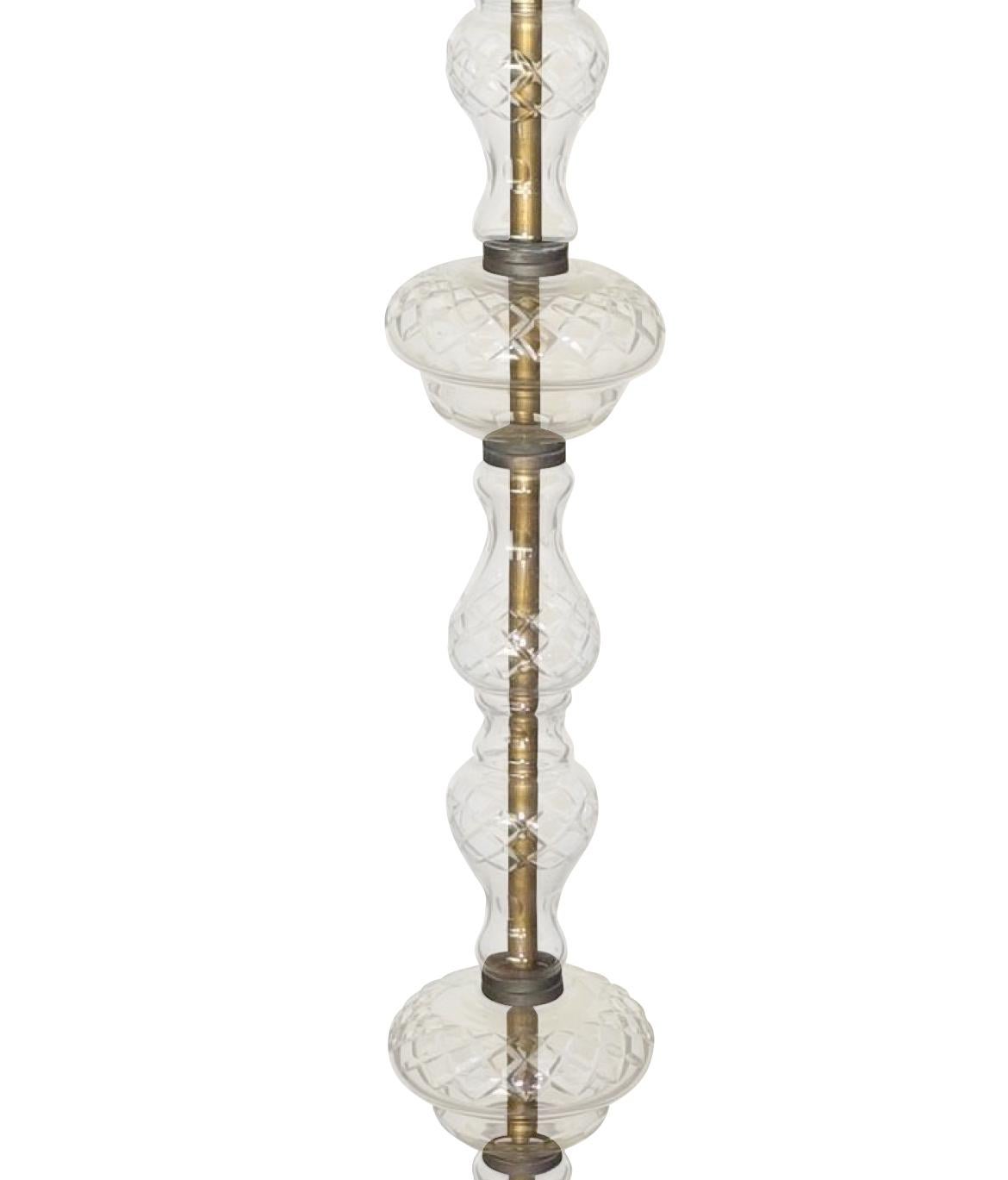 1940s Italian five-arm Murano glass candelabra floor lamp.
The entire column is Murano glass.
There are 64 decorative Murano glass crystals.
The base is decorative brass.
Recently rewired.

  