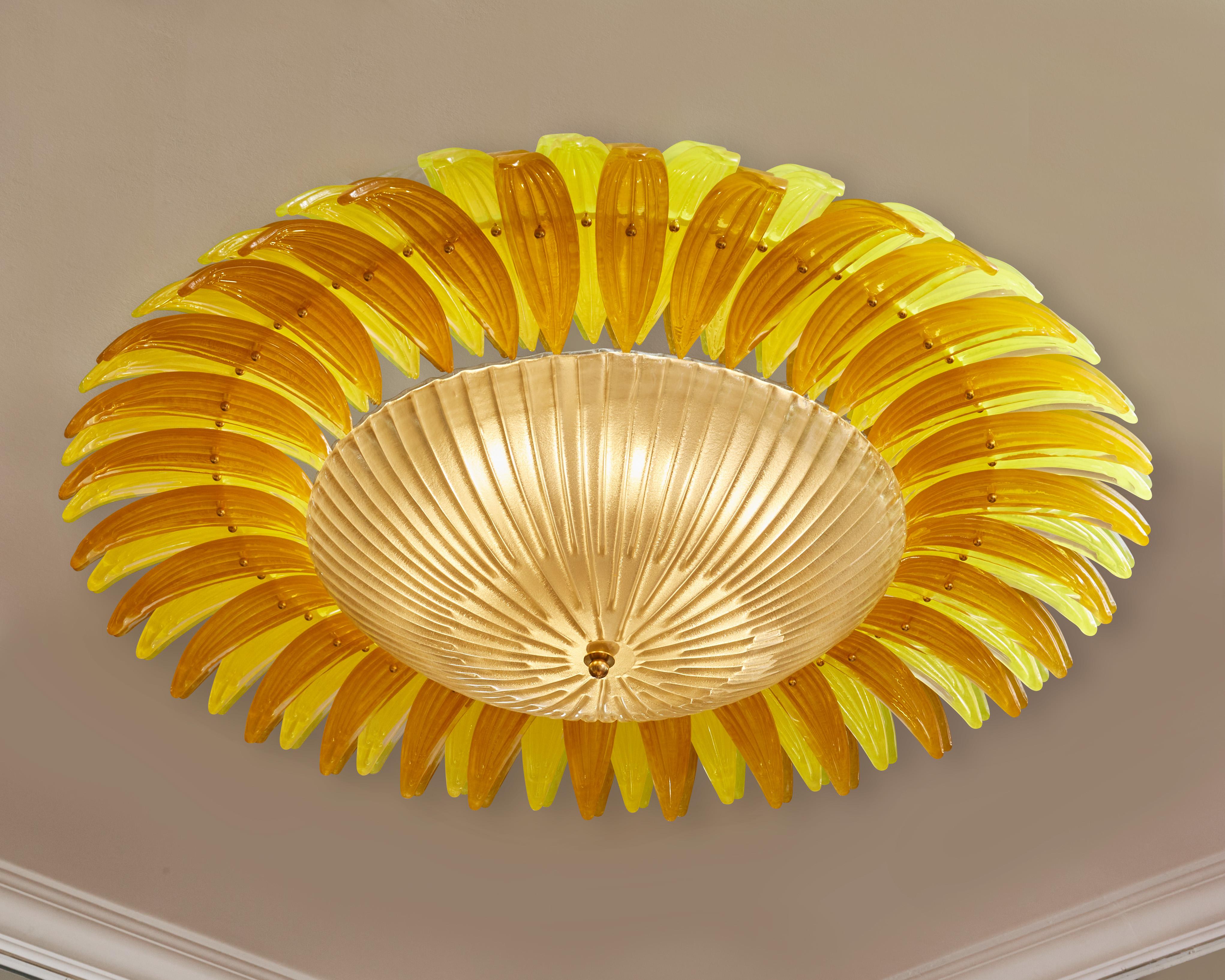 Elegant ceiling light entirely made of brass with tainted and sculpted Murano glasses.
Creation by Studio Glustin.