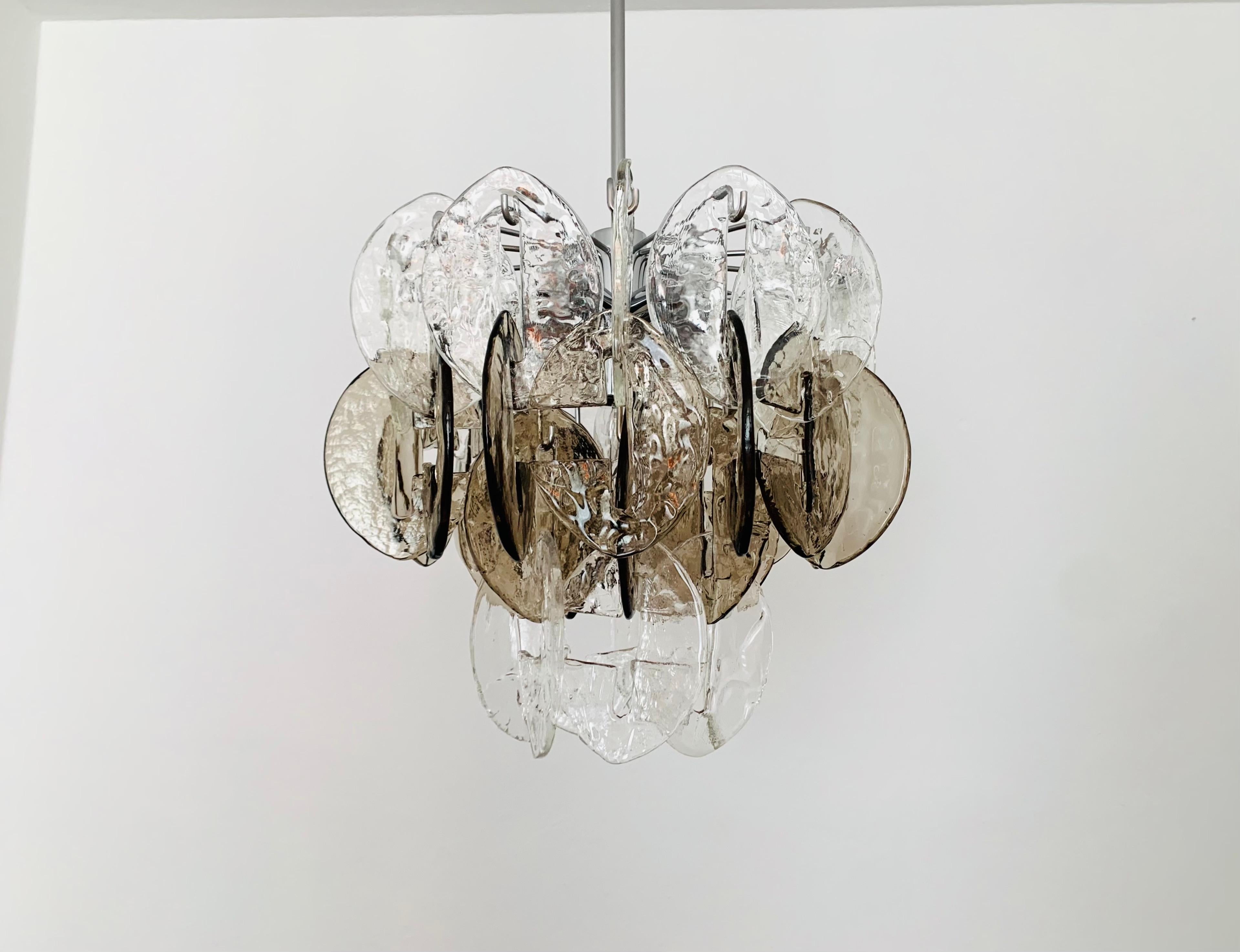 Very beautiful and large Murano glass chandelier from the 1960s.
High-quality workmanship and fantastic design.
The structure of the 32 glasses creates a very sparkling light.

Manufacturer: Kalmar Franken KG
Design: Carlo Nason

Condition:

Very
