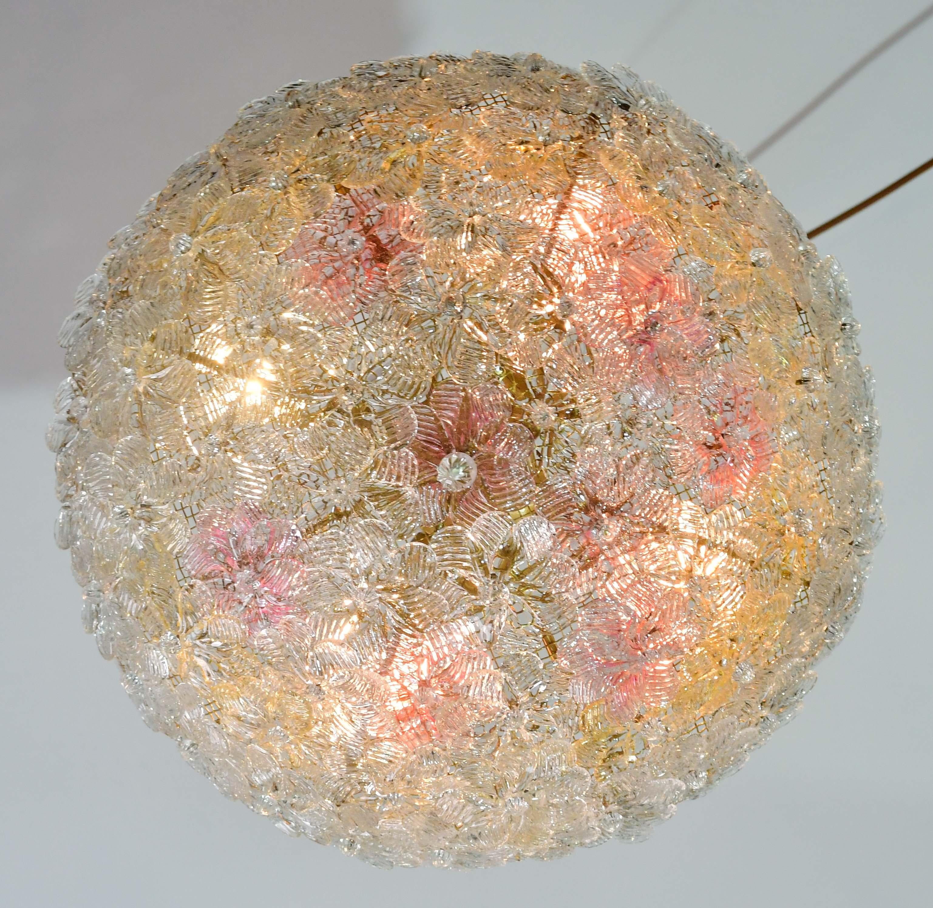 pretty four-light ceiling lamp with Murano glass flowers, made by Seguso for Venini, Italy, 1960s.
Metal ceiling basket with overlapping flowers made of hand-blown Murano glass in gold and transparent color with gold inclusions, attached