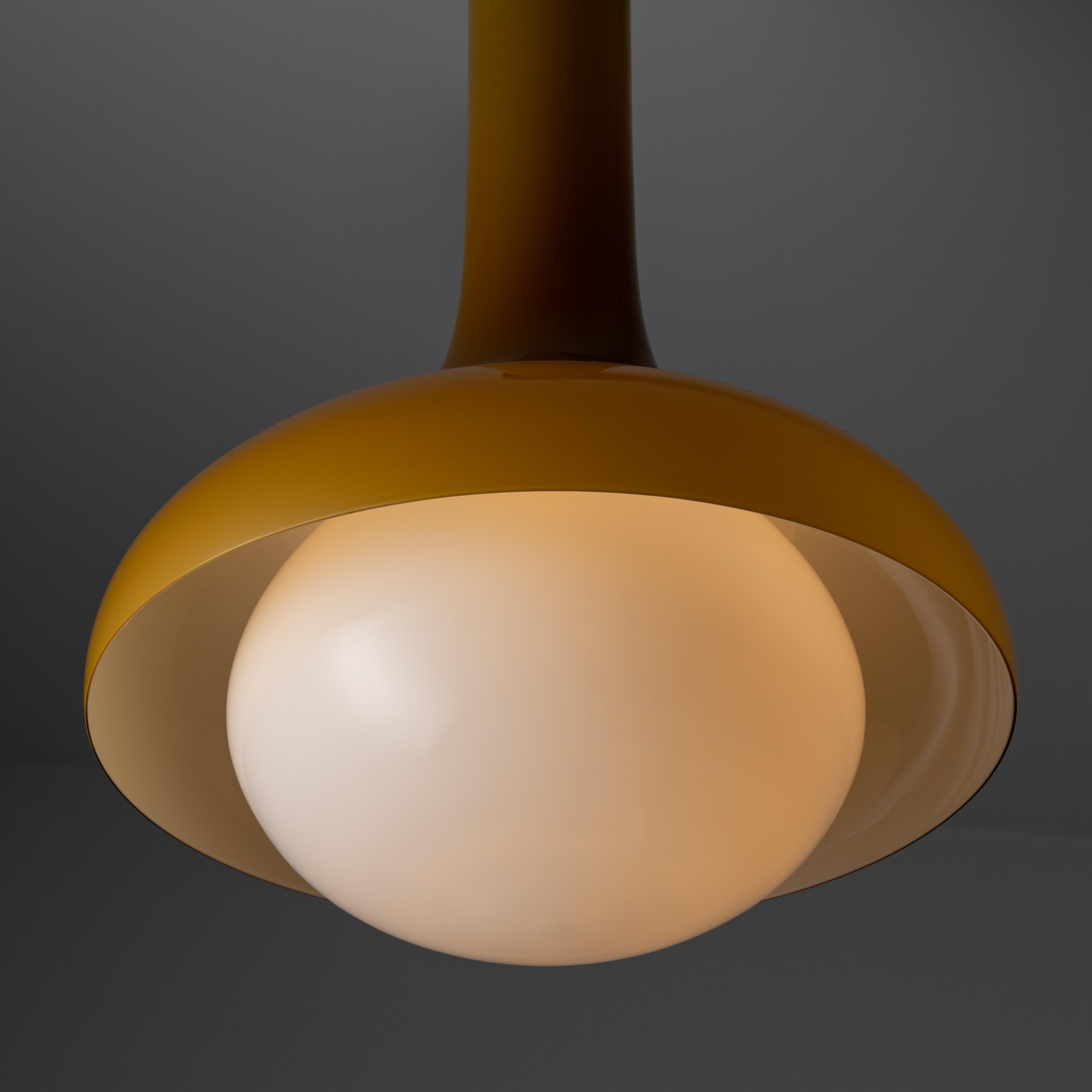 Murano glass ceiling light by Carlo Nason for Vistosi. Designed and manufactured in Italy, circa the 1960s. Beautiful orange tinted all Murano glass stem and outer-shade, paired with an opaline glass bottom diffuser. Brass cuffed canopy at the top.