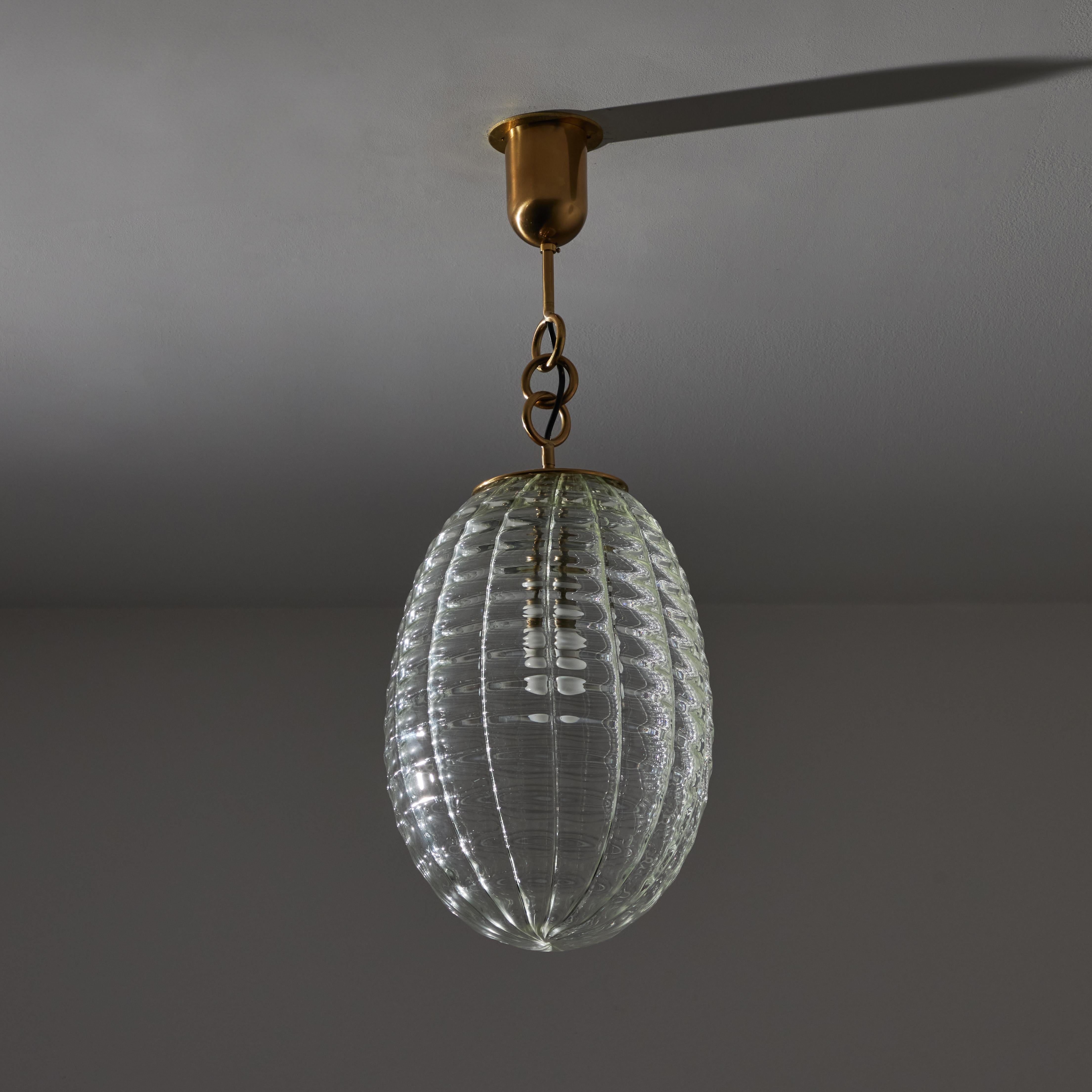 Murano Glass Ceiling Light by Carlo Scarpa for Venini, Italy, 1940s. A hand-blown ribbed Murano glass orb suspended by a few brass rings. This light has a single E27 socket type, adapted for US standards. Recommended 40-60w max or LED equivalent.