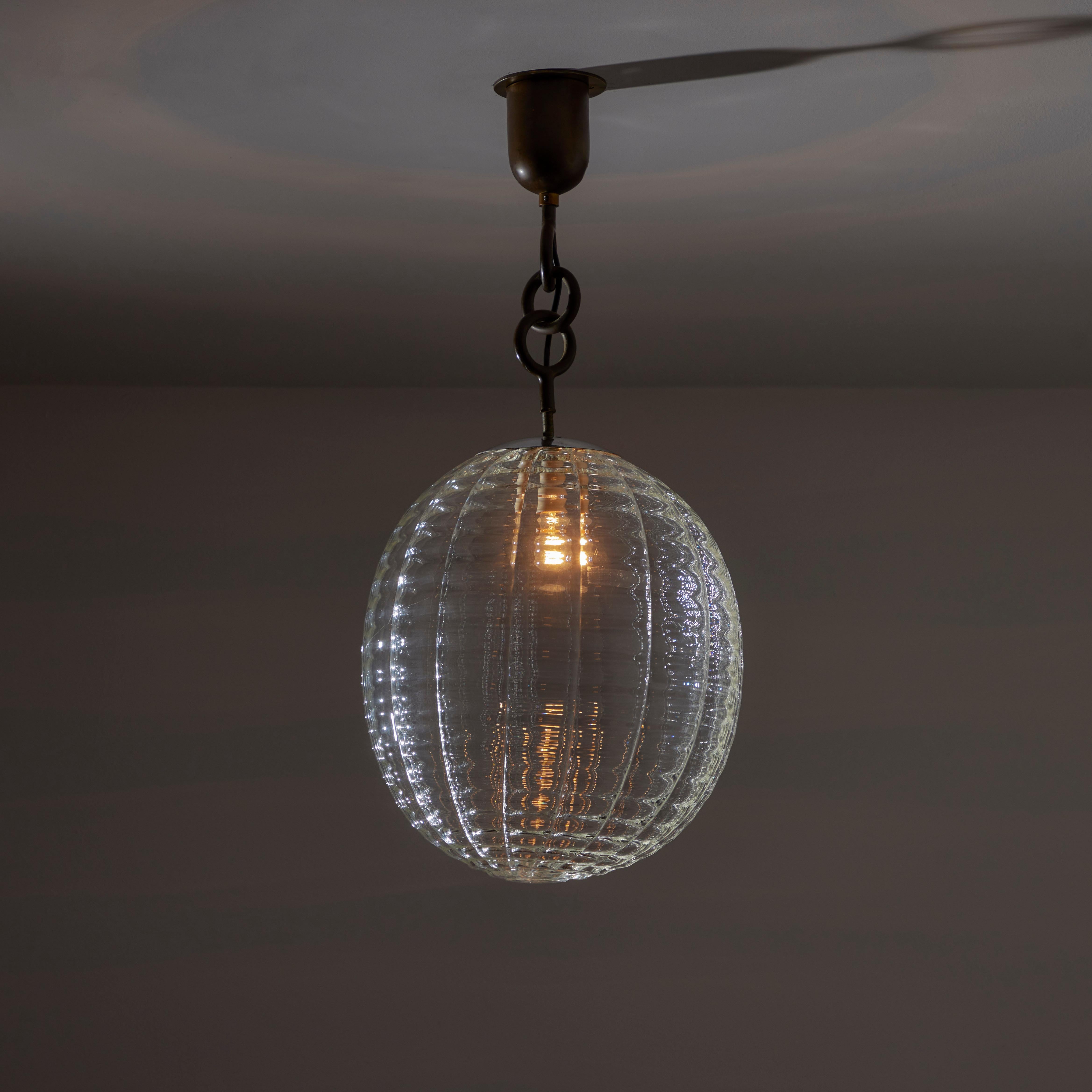 Murano Glass Ceiling Light by Carlo Scarpa for Venini, Italy, 1940s. A hand-blown ribbed Murano glass orb suspended by a few brass rings with a beautiful patina. This light has a single E27 socket type, adapted for US standards. Recommended 40-60w