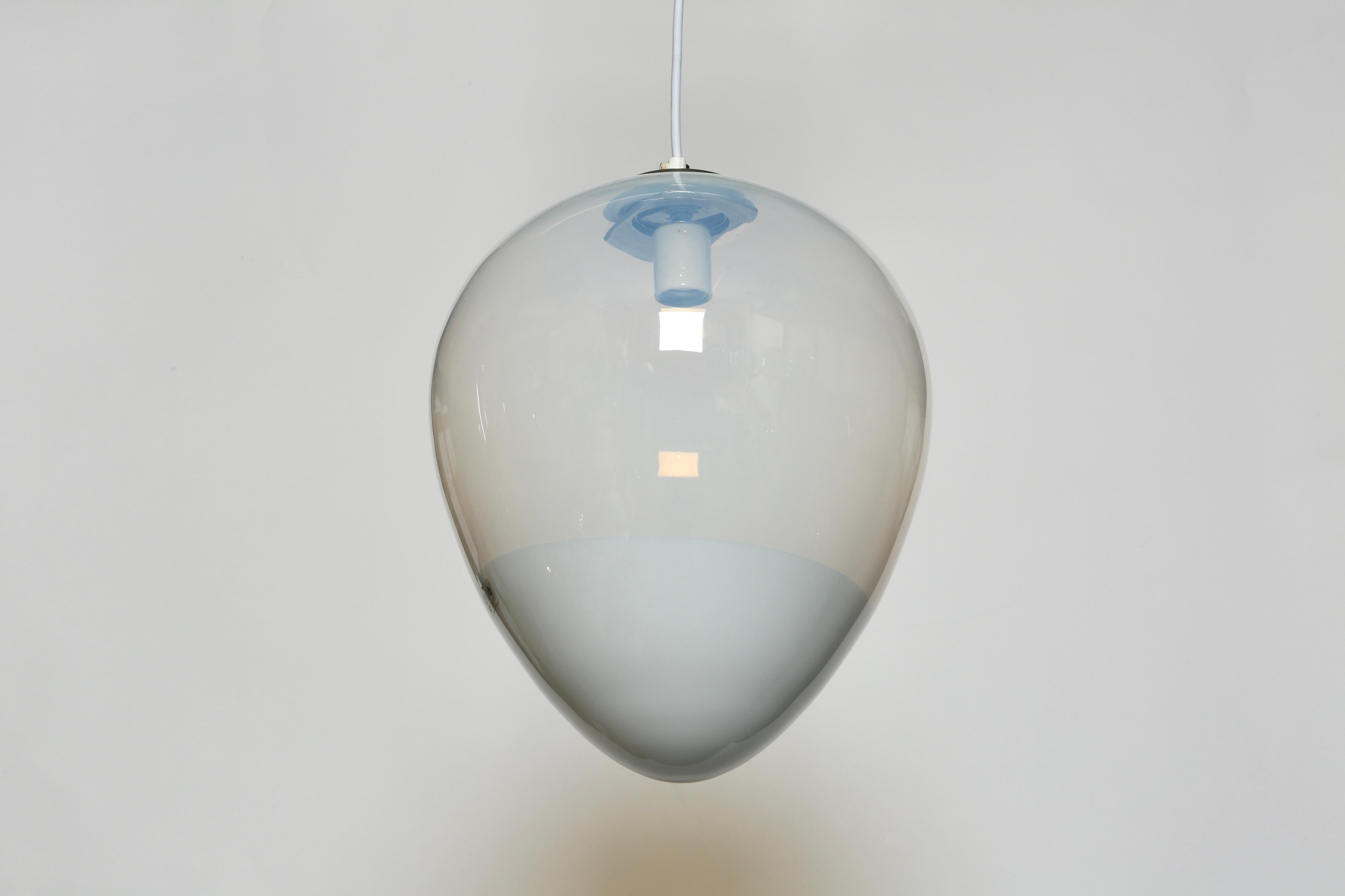 Murano glass ceiling pendant by Leucos.
Made in Italy in 1970s.
Handblown glass.
Rewired for US.
Takes one medium base bulb.
Overall drop is adjustable, can be shorter.
1 ceiling pendant is available.
Price is for 1 pendant.

We take pride in
