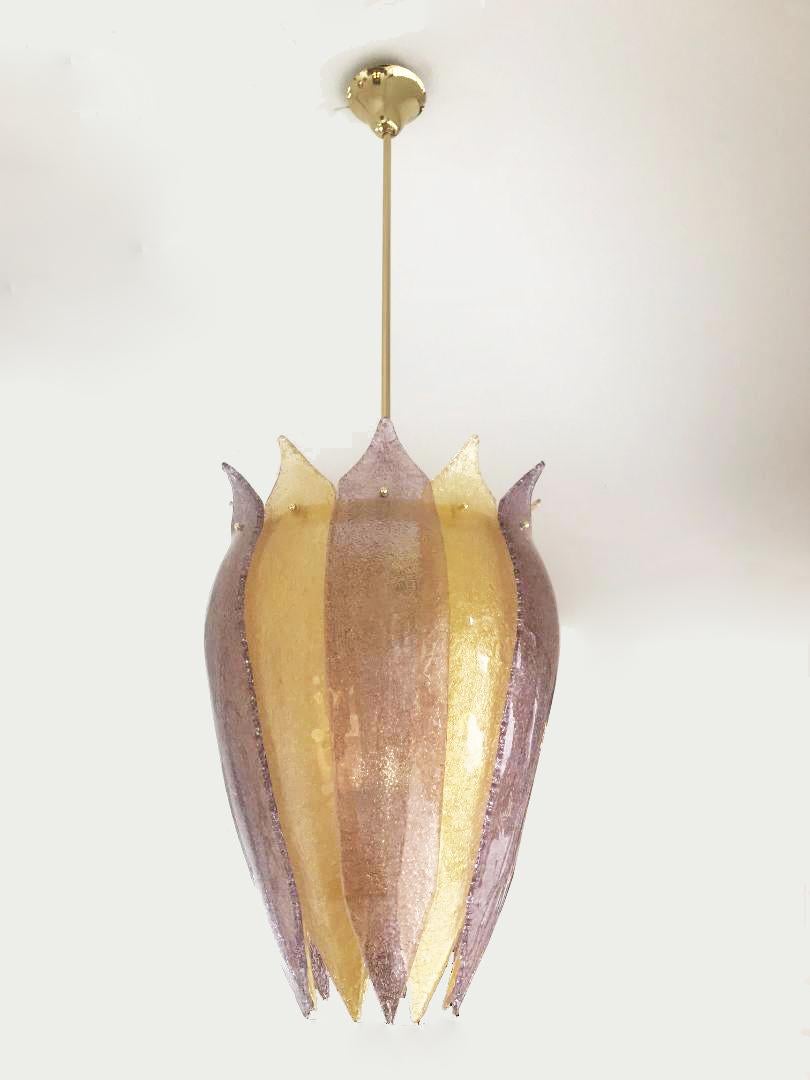  Murano glass lantern or cesendello, in Stock
Curved form “graniglia” hand blown glass leaves in gold and amethyst.
Silhouette is inspired by the ancient street lanterns of Venice
Brass structure with a 65