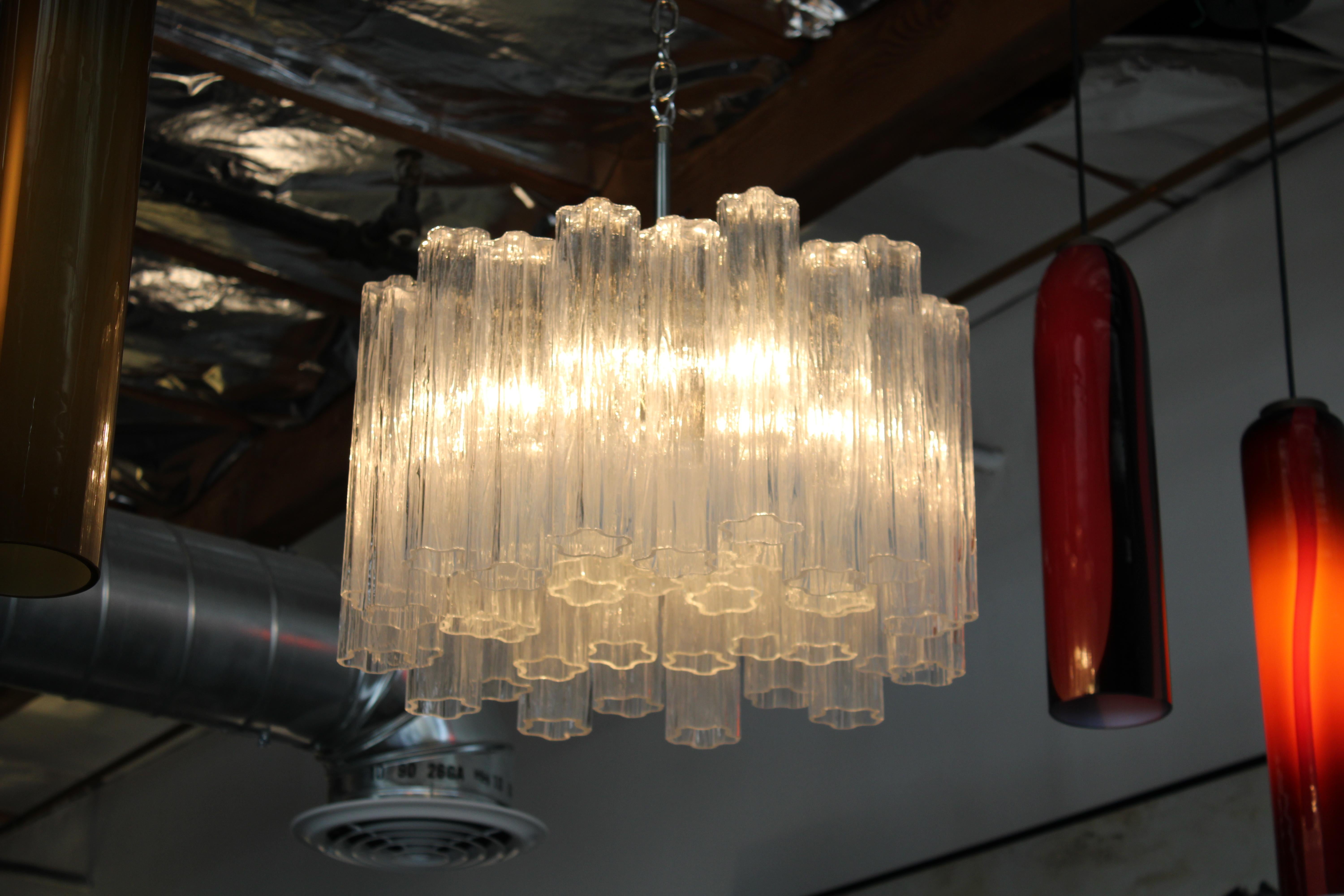 Glass murano chandelier attributed to Venini. There are 22 large glass tubes that fit on the upper support measuring about 12