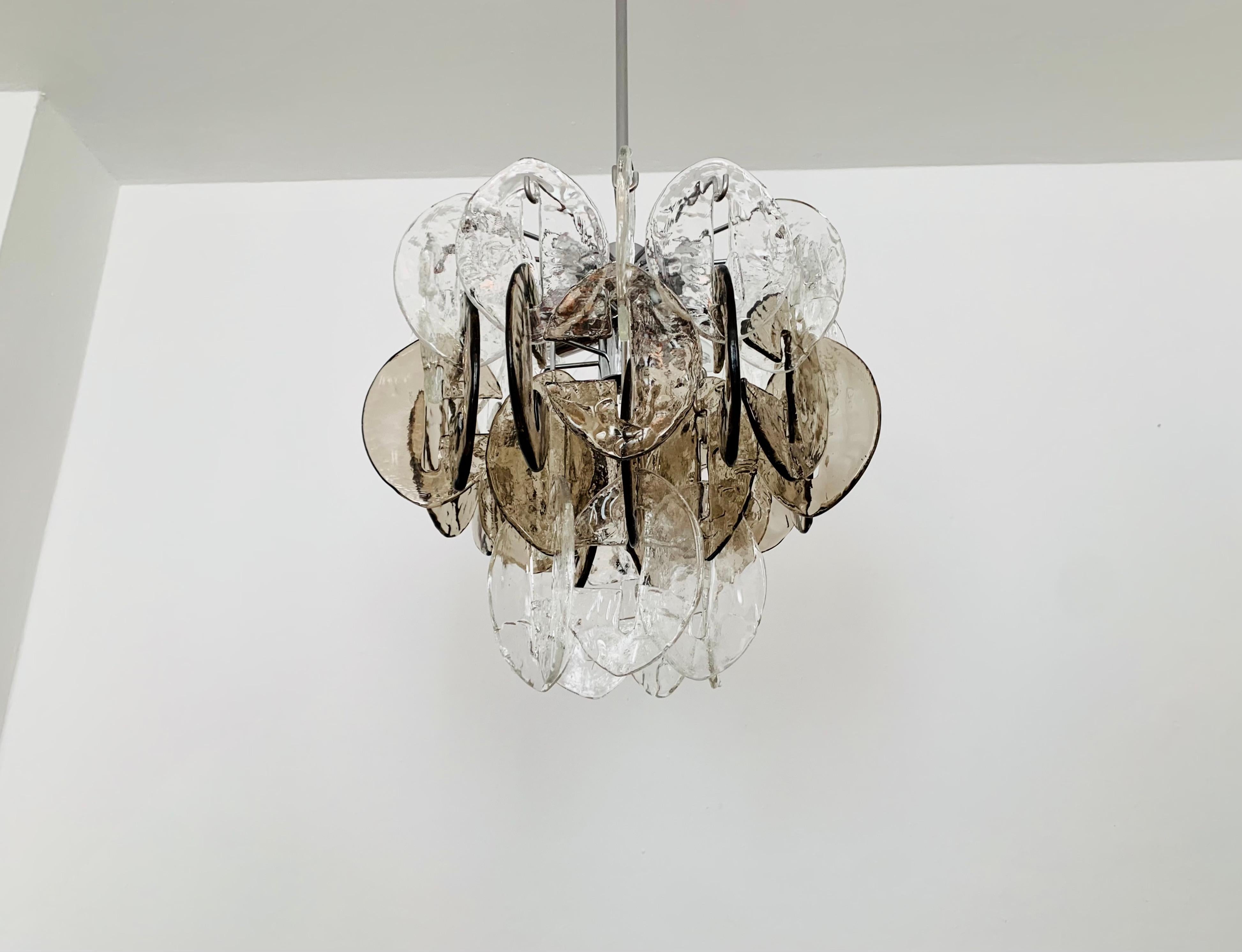 Very beautiful and large Murano glass ceiling lamp from the 1960s.
High quality workmanship and fantastic design.
The structure of the 32 glasses creates a very sparkling light.

Manufacturer: Kalmar Franken KG
Design: Carlo Nason

Condition:

Very
