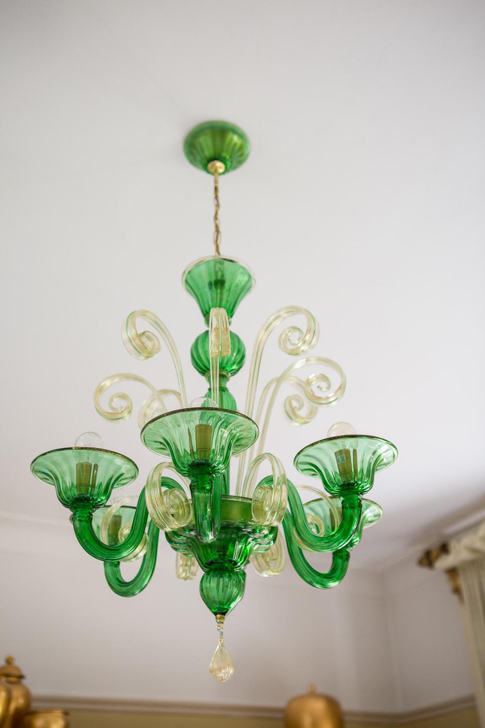 The stunning classic Murano Glass chandelier made by the renowned furnace Mazzuccto Murano in the centuries old technique of mouth blown glass on the island of Murano in Venice

Made of Green (Verde) and Clear (Cristallo) Glass with 24Ct Gold Leaf