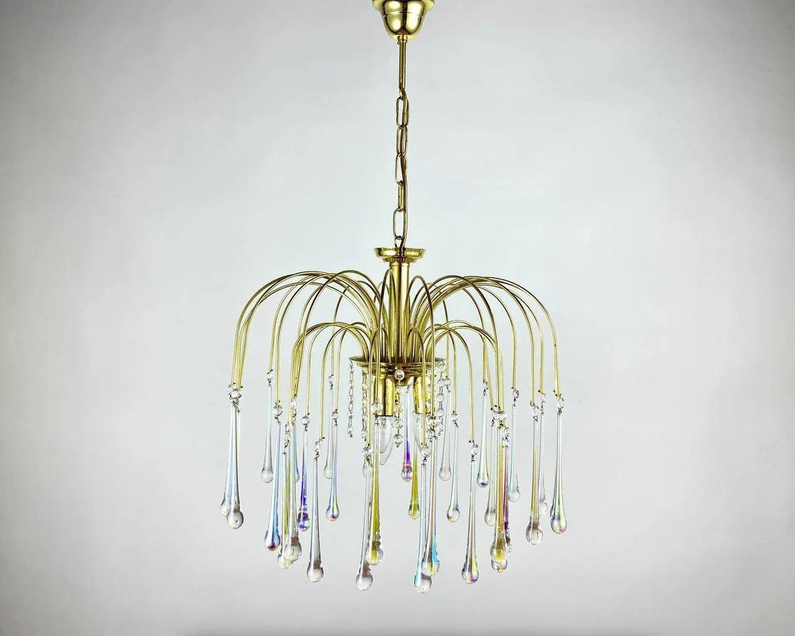Vintage Italian Murano handblown glass teardrops Chandelier By Massive Belgium Manufacturer, circa 1960s.

Gilt Metal cascading waterfall chandelier.

The naturalness of the composition is added by pendants made in the form of multi-colored
