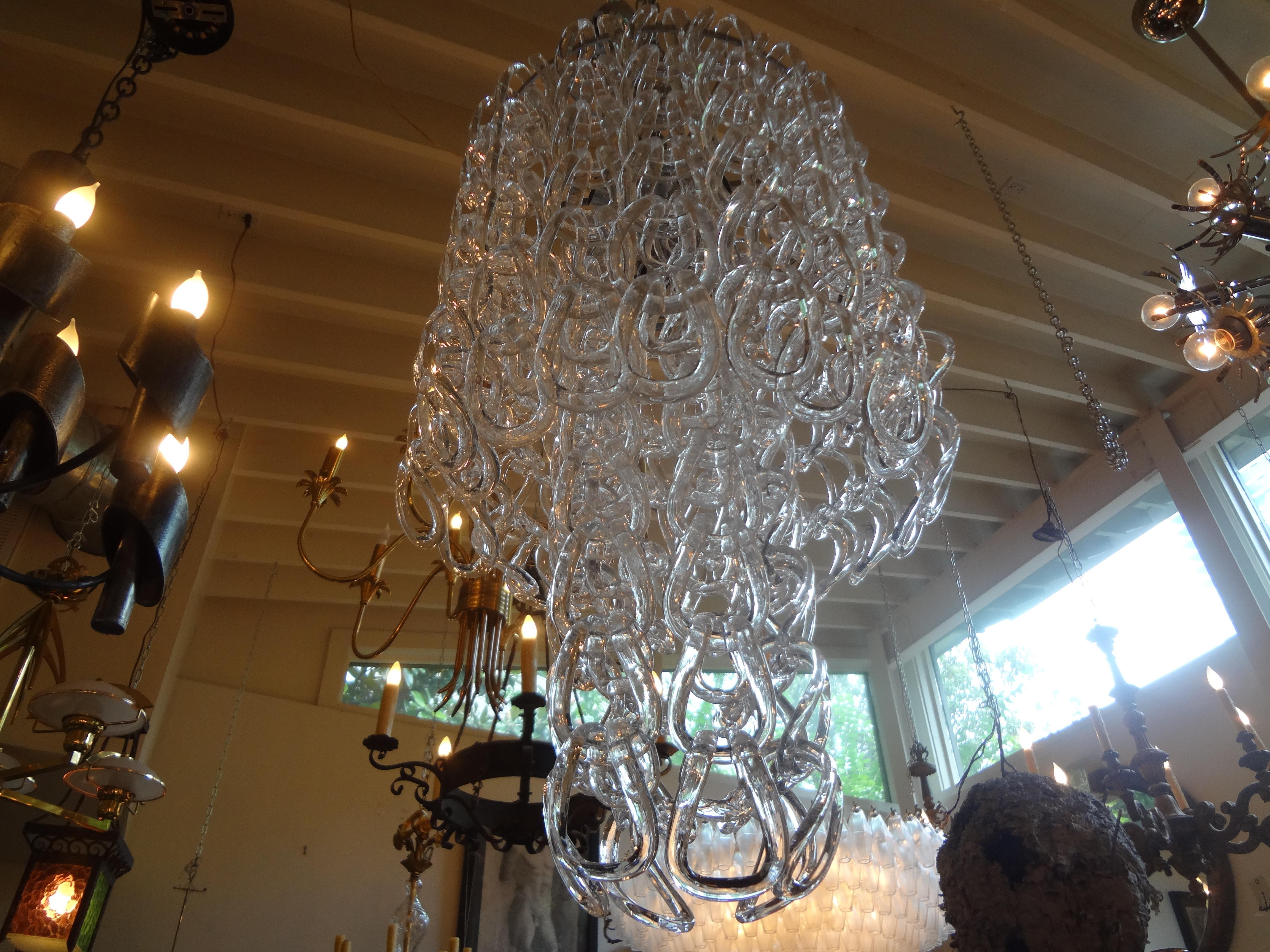 Murano chandelier, Mangiarotti inspired.
Interesting large Murano chandelier or Murano glass lantern inspired by Mangiarotti of Murano, Italy. This stunning Mid-Century Modern Murano glass chandelier has blown glass chain pendants creating a lovely