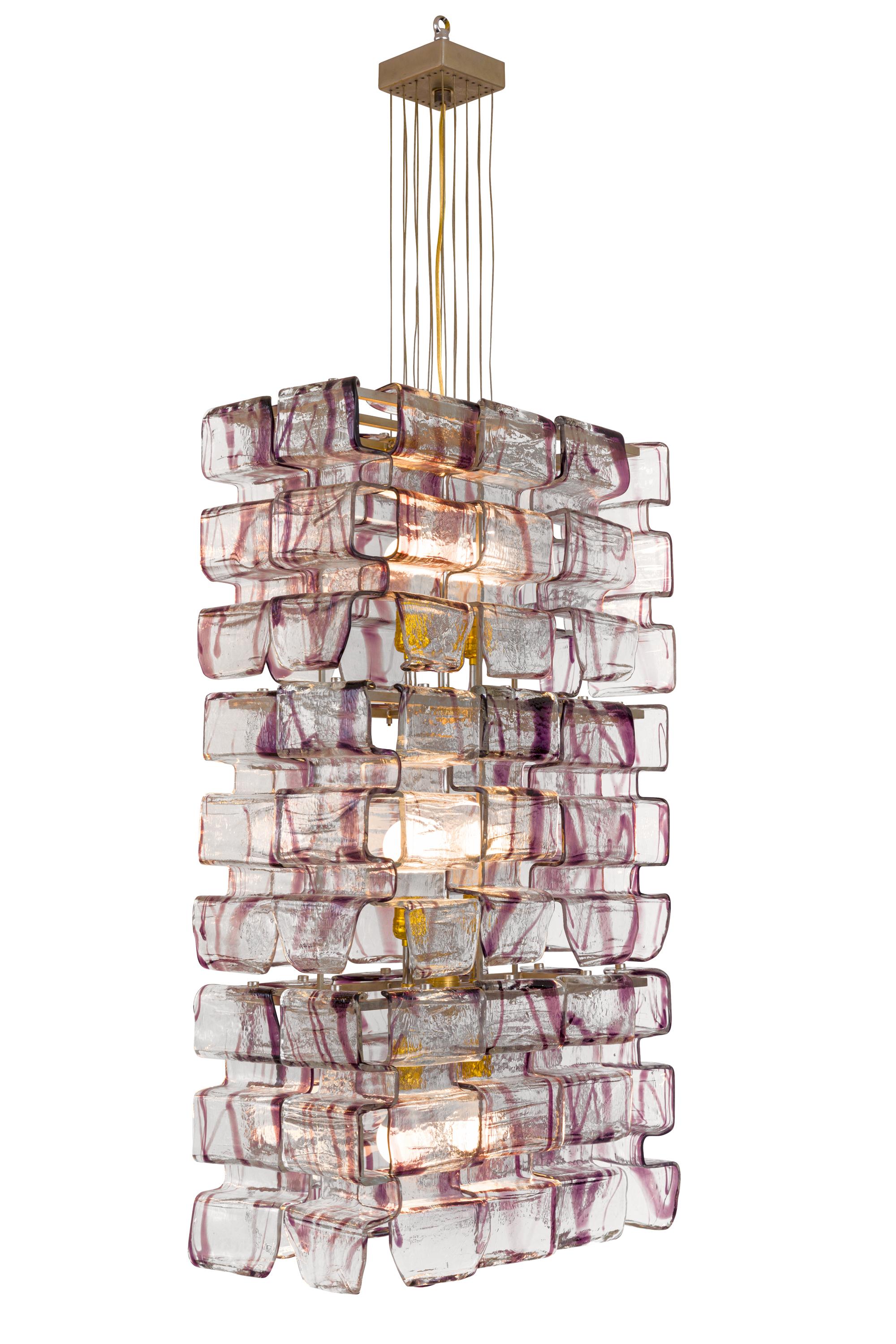 One of a series of chandeliers that were originally in a casino in Italy. They have a spectacular look due to the shape of the Murano glass elements that hang from the frame. We have numerous sizes available. The measurements indicated include the