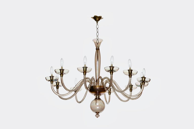 Murano glass chandelier by Pietro Toso.
Italy 1950s
Hand blown glass, brass
12 candelabra sockets.