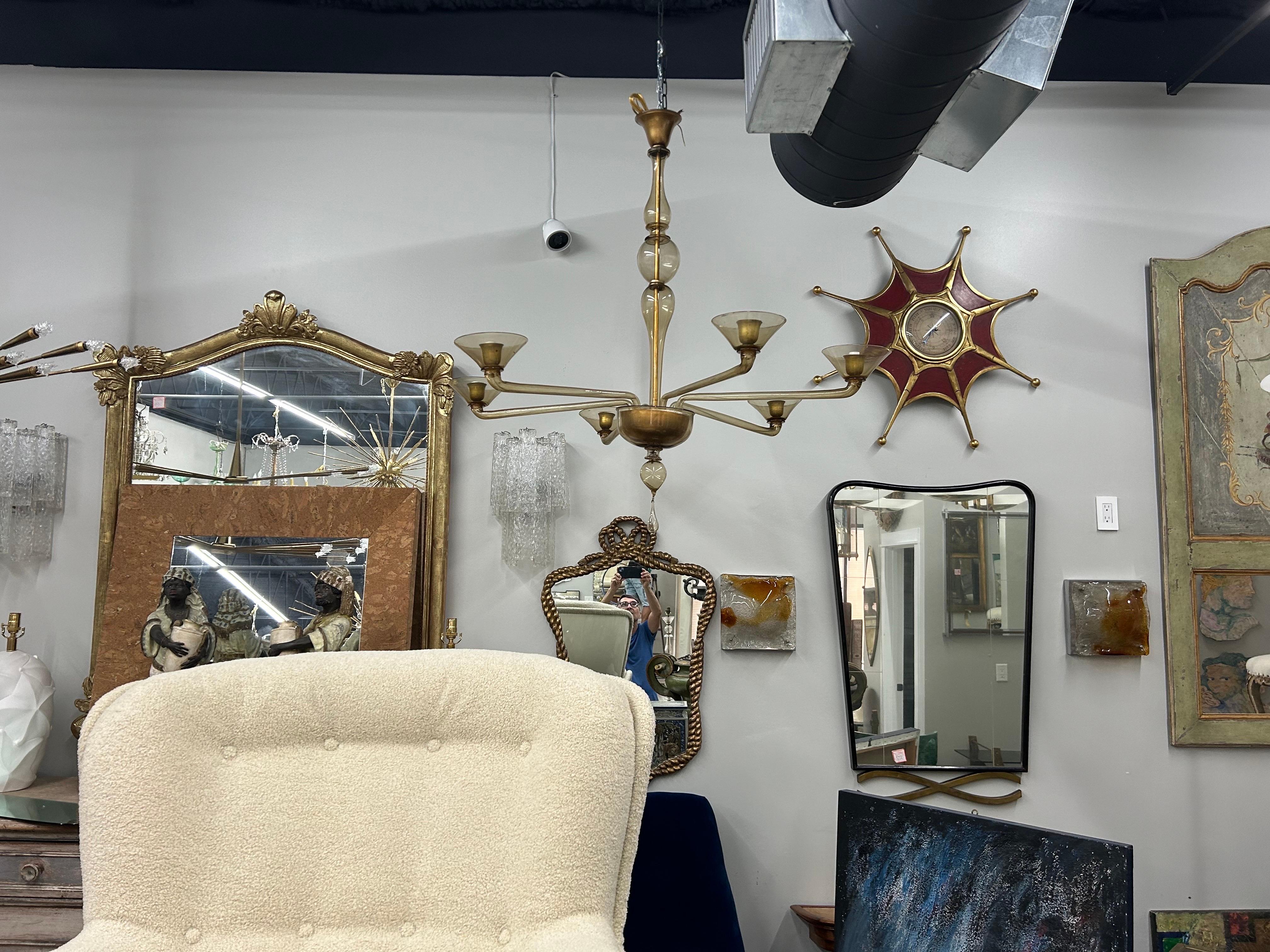Murano Glass Chandelier By Seguso. Offered is a stunning mid century Murano glass chandelier attributed to Archimede Seguso circa. 1940.
This six light gold Murano chandelier has been newly wired with new sockets for the U.S. market
Stunning!