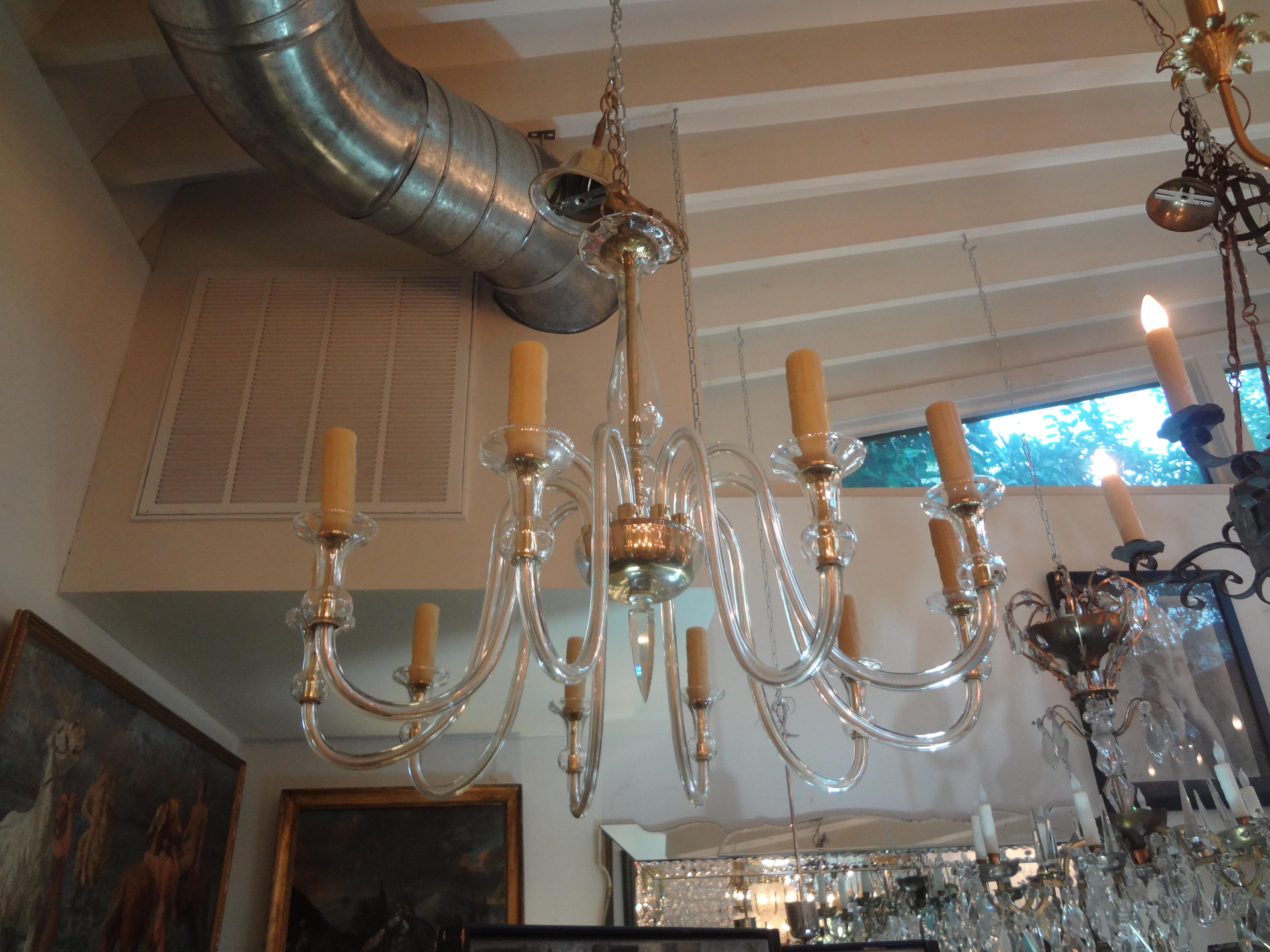 Stunning murano glass chandelier attributed to Seguso. This chic murano glass chandelier has 10-light and an unusual faceted bottom finial.
This murano chandelier has been newly wired to U.S. specifications. Our Murano glass chandelier can be hung