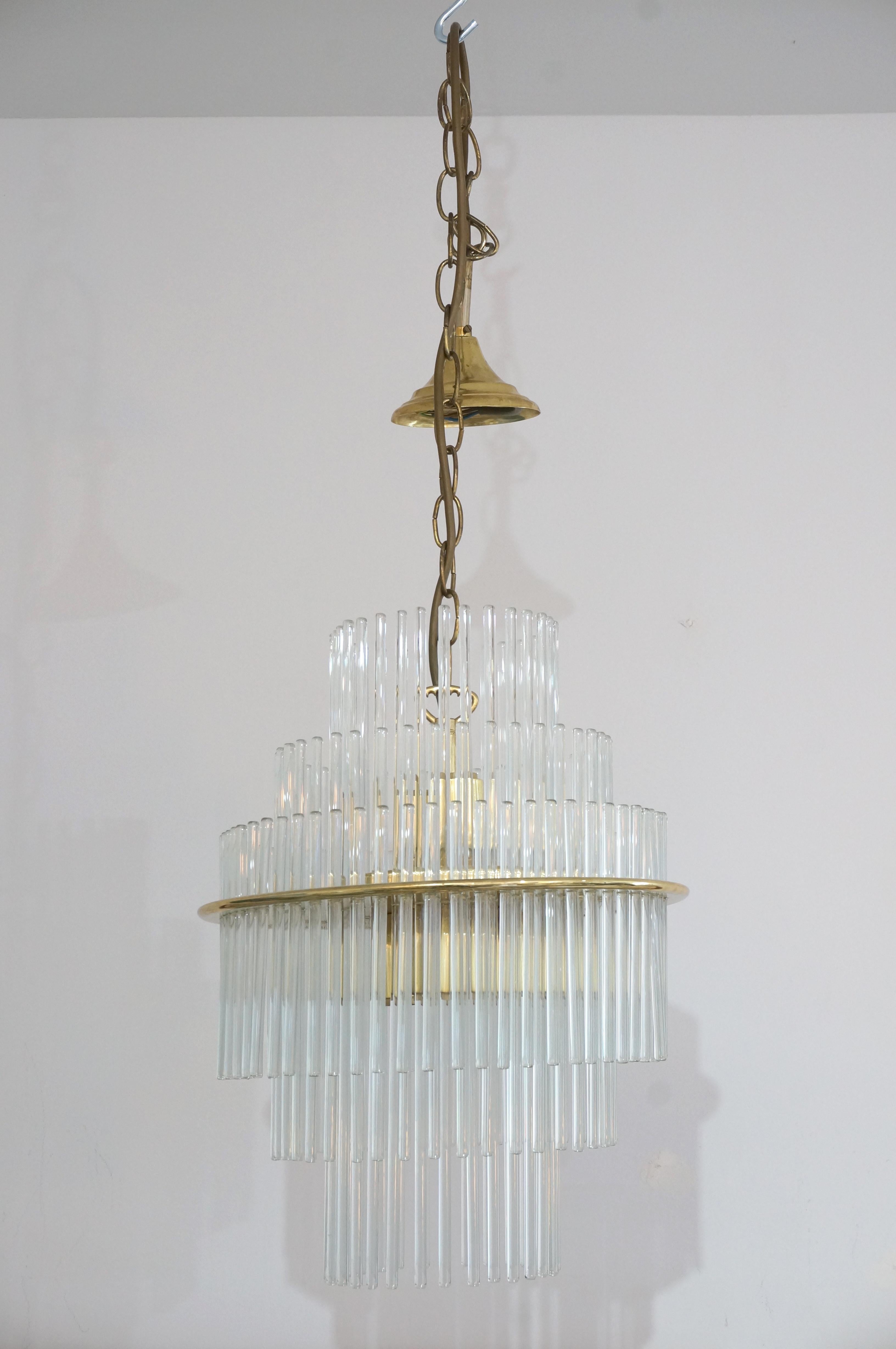 This stylish anc chic Mid-Century Modern chandelier dates to the late 1960s to early 1970s and was created by V. Nason & Co.

Note: Requires five candleabra based bulbs.

Note: Overall dimensions are 43