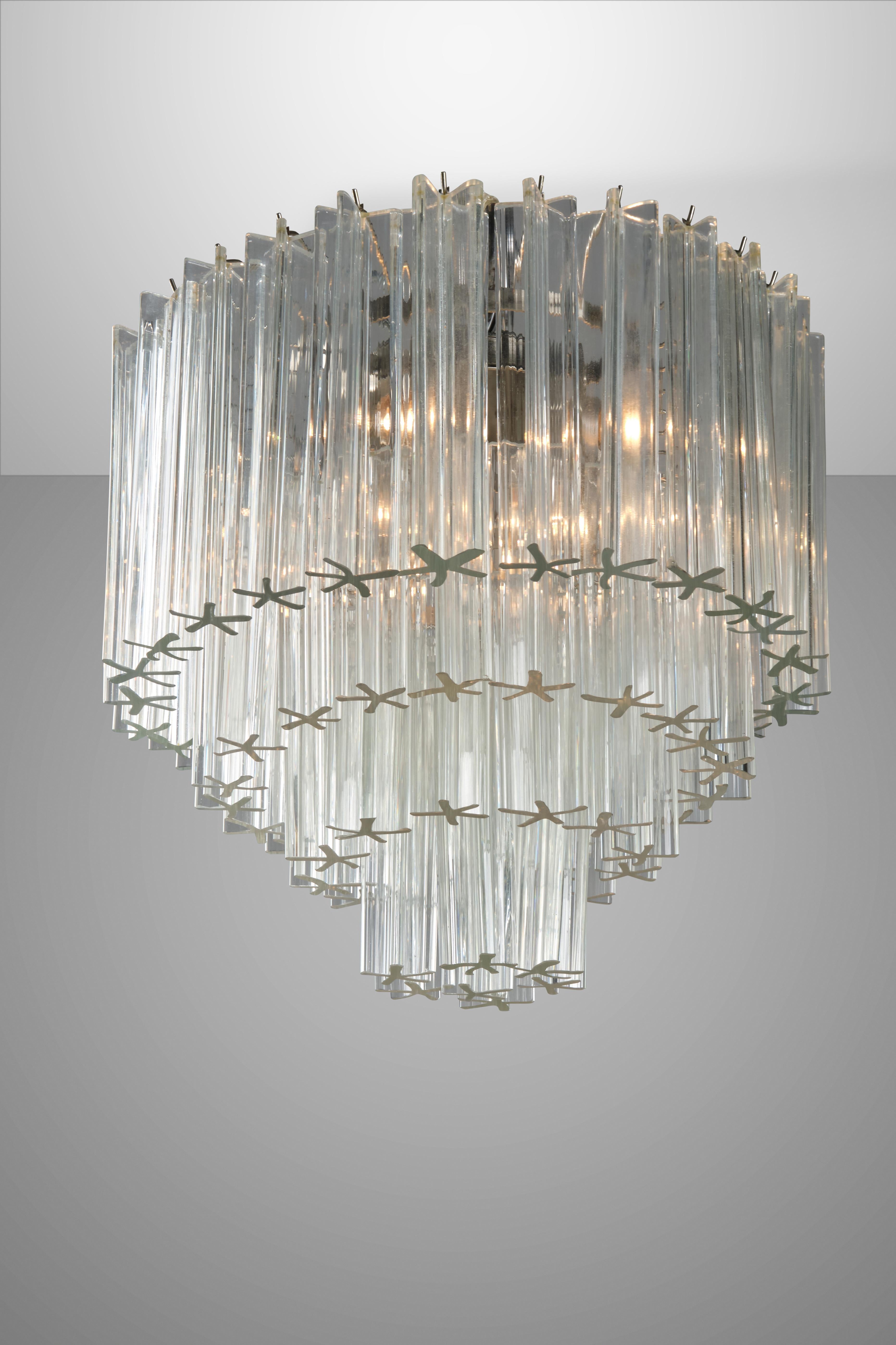 These two chandelier features a metallic strucuture and magnificent light diffusers in Murano glass with a unique star shape. Manufactured by Venini in the 60s, these items are a true must-have for all Italian Design lovers.
 