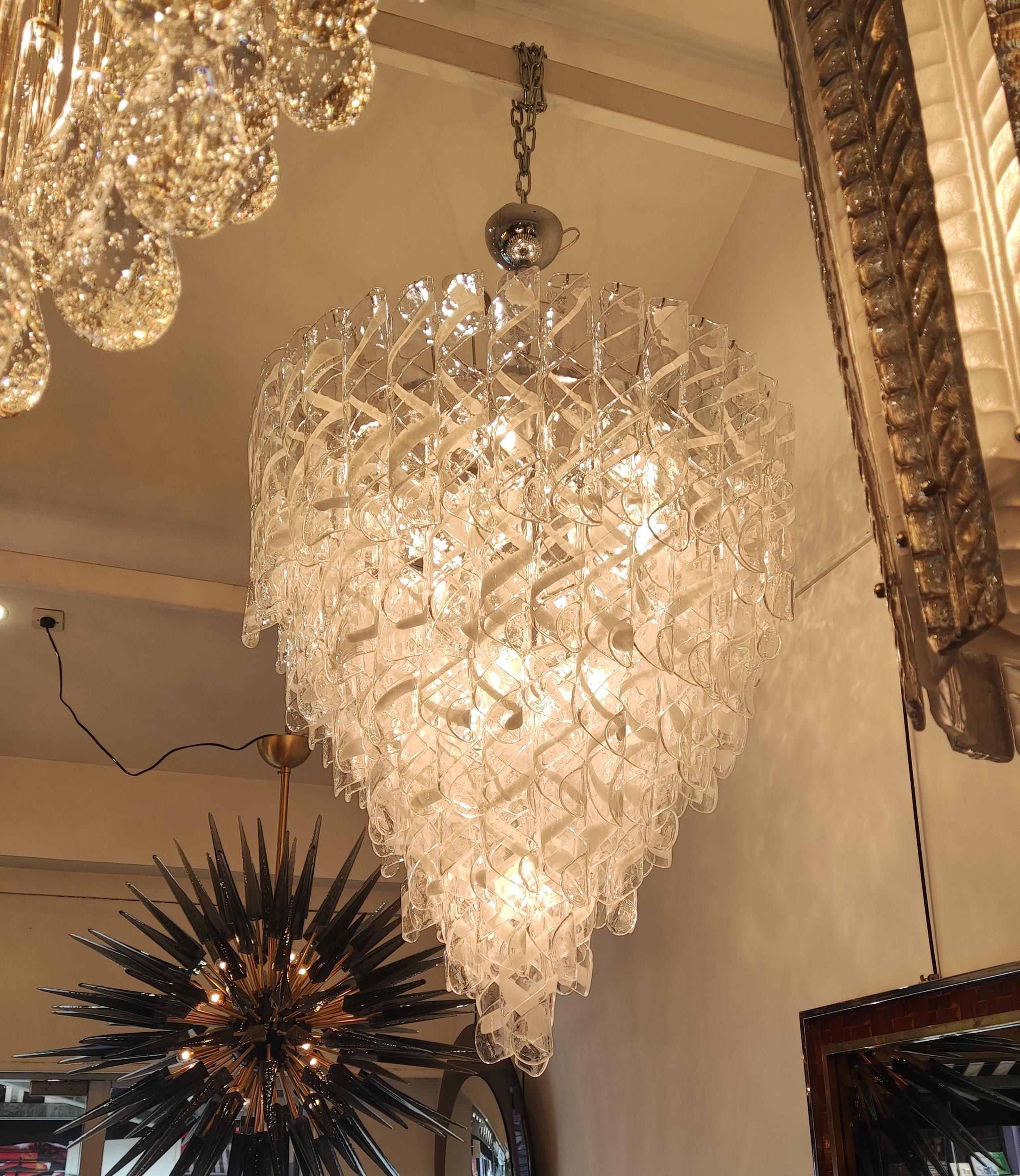 Huge Murano glass chandelier, with 134 white and transparent pendants,
12 E27 bulbs ( european or us standards )
Measures: h 110cm + chain 40cm.