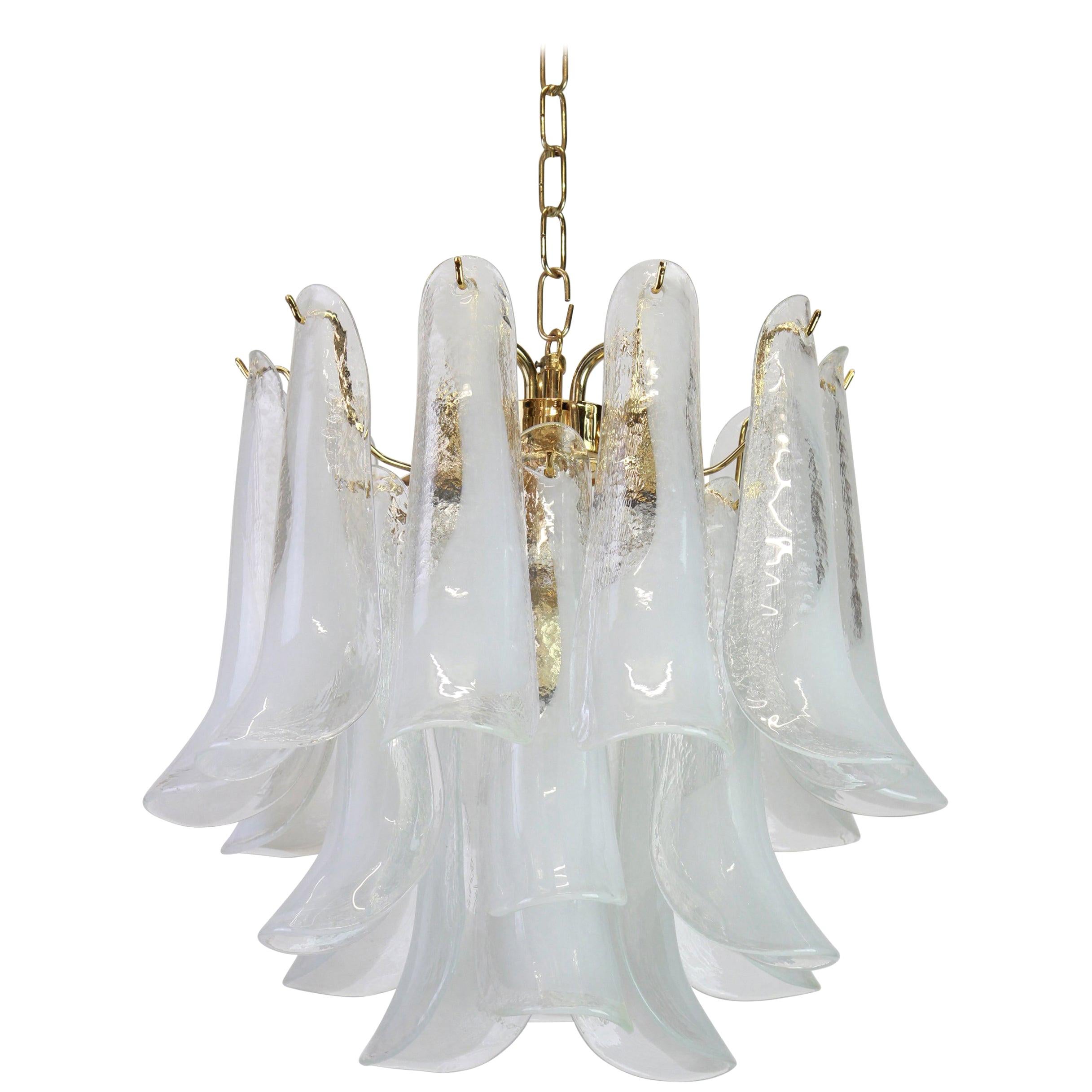 A stunning Murano glass chandelier designed by Carlo Nason for Mazzega, Italy, manufactured in the 1970s.
The chandelier is composed of 19 thick textured glass elements attached to a brass metal frame.

High quality, very good condition. Cleaned,